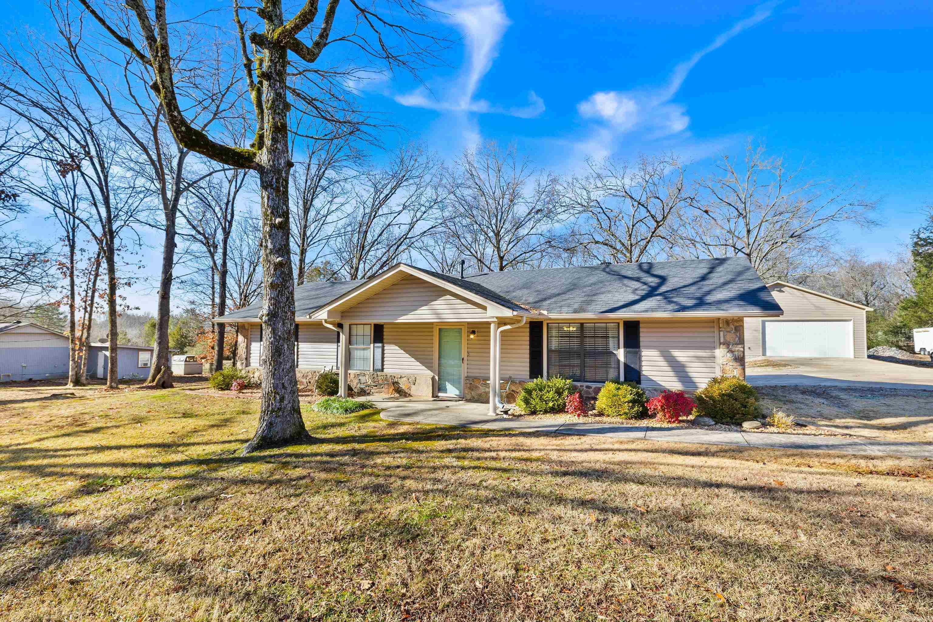 Turn-key three bedroom home on nearly an acre with 30x36 shop! Home is immaculately maintained with wood flooring in living and master.  Shop has electricity with auto garage door. Covered parking for vehicles, trailers, or camper. Check out this country paradise today!