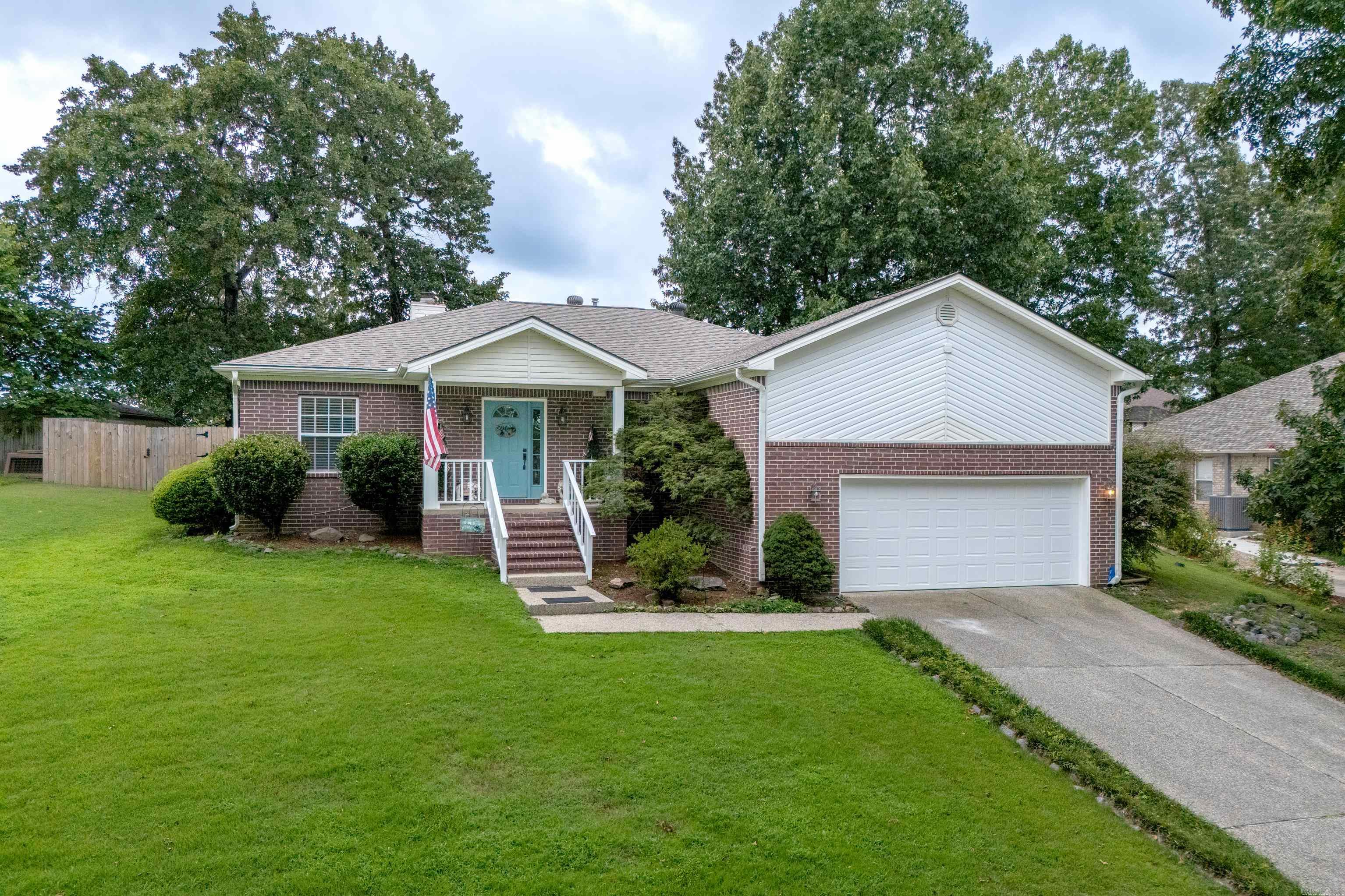 Welcome home to this beautifully maintained 3-bedroom, 2-bath residence located in the highly desirable Lake Hamilton School District! Featuring a bright, open floor plan, this home is perfect for both everyday living and entertaining. The spacious living area is highlighted by a cozy gas fireplace and durable luxury vinyl plank flooring throughout the main living spaces. The private primary suite offers a relaxing retreat with an en-suite bath featuring a dual vanity, corner jetted tub, separate shower, and ample storage. The guest bathroom has been tastefully updated with a custom-tiled shower, adding both style and convenience. Step outside to enjoy the fully privacy-fenced backyard, complete with a covered patio, beautiful landscaping, and plenty of space for outdoor gatherings or quiet evenings at home. Additional features include a covered front porch and two-car garage. Conveniently located just minutes from Lake Hamilton access, this home offers the perfect combination of comfort, style, and location. Don't miss your opportunity to make this exceptional property your new home!