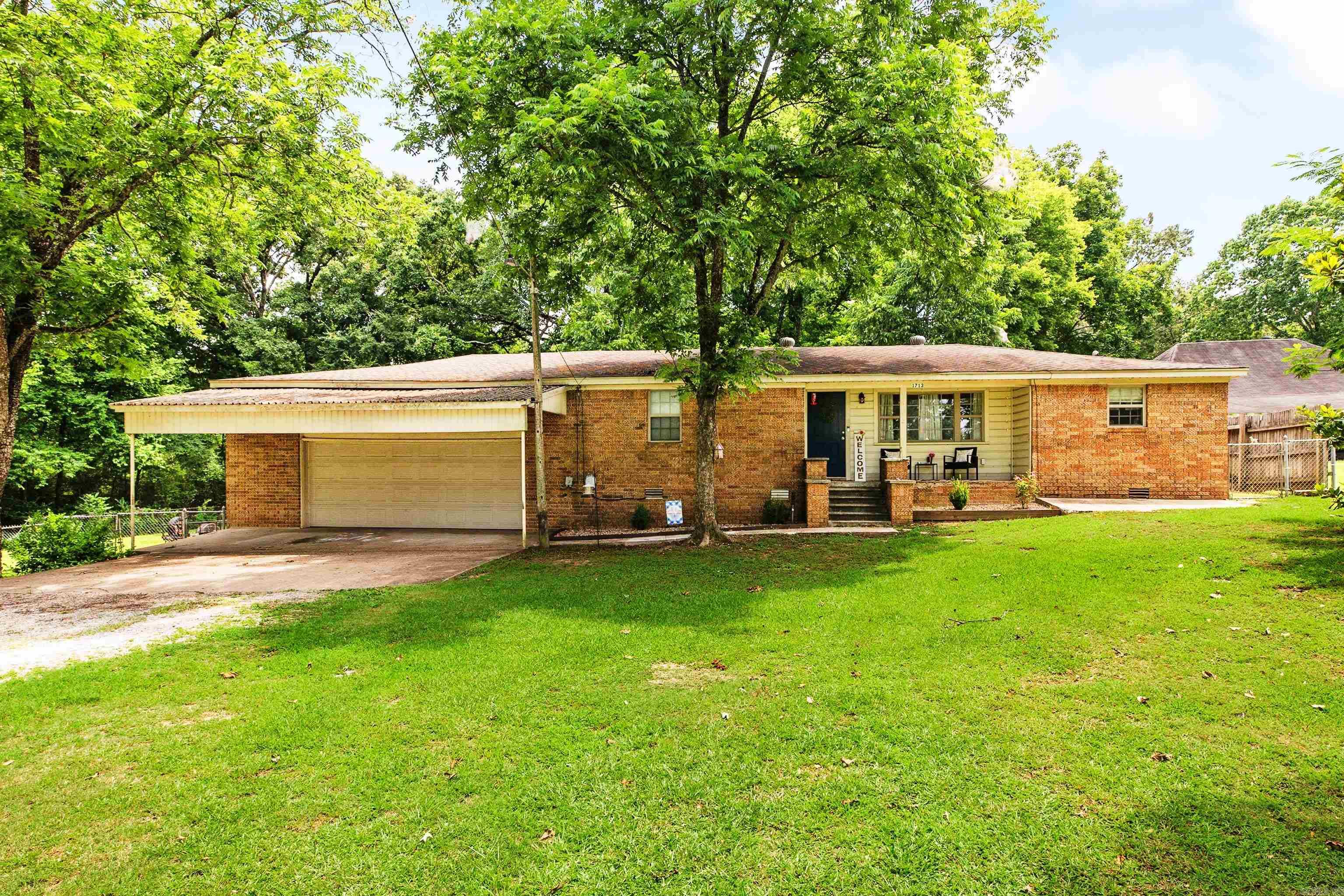 Move-in ready and zoned for Bryant Schools (Salem/Bethel)! This all-brick home in the heart of the Salem community of Benton offers a hard-to-find combination of privacy and convenience. Situated on approximately 0.69 acres and set back from the road, the property provides a peaceful, rural setting while remaining just minutes from shopping, dining, schools, and everything Benton and Bryant have to offer. The interior is thoughtfully updated and well maintained, reflecting pride of ownership throughout. Outside, you'll find a large, level lot with mature trees, a spacious, fully fenced backyard, and a storm shelter. Whether you're looking for extra space, a quiet setting, or a home that's ready to enjoy from day one, this property checks all the boxes. Schedule your showing today!