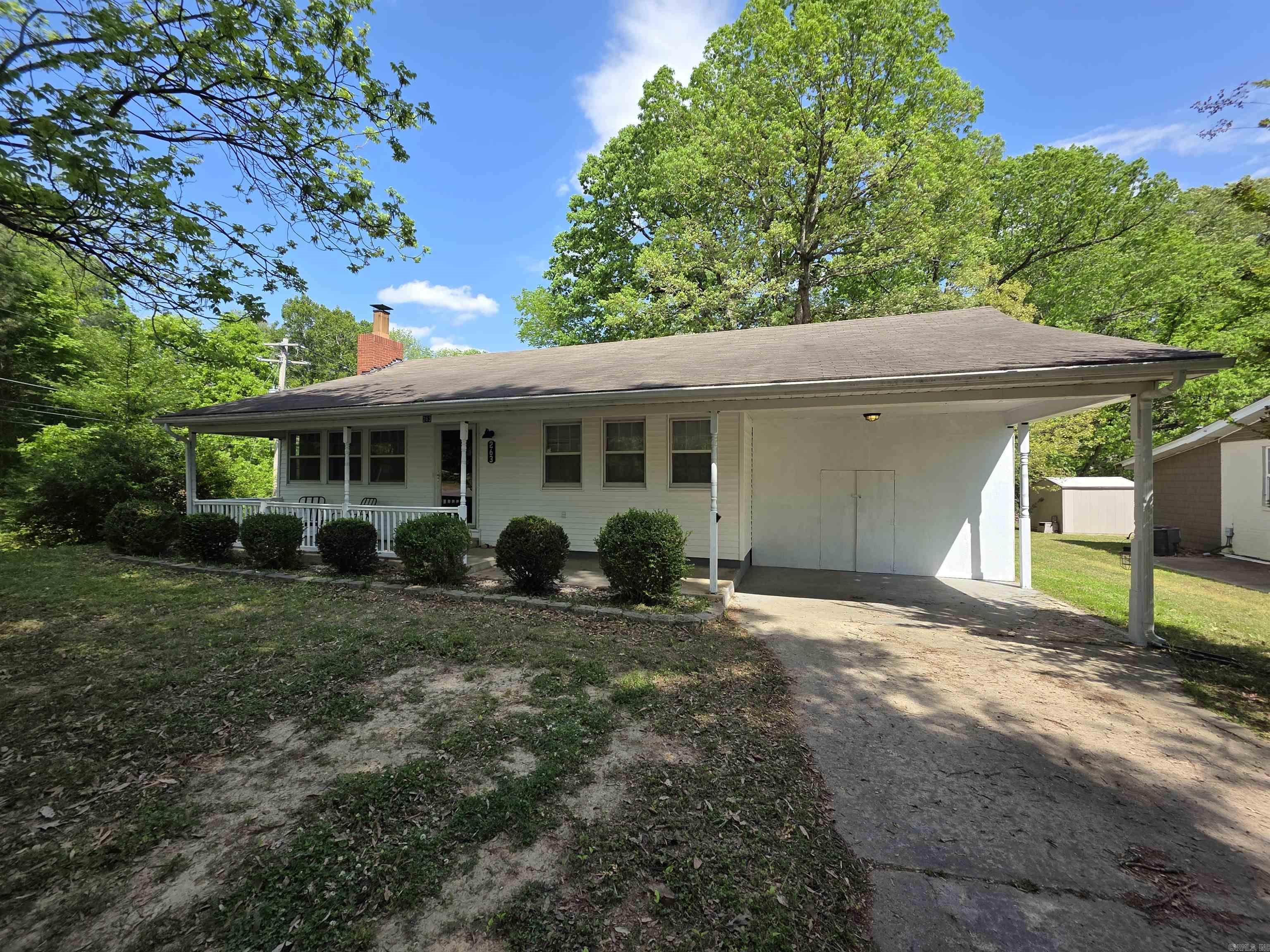 Charming 2-bedroom, 1-bath home with 1,111 sq ft of comfortable, well-designed living space on a spacious 0.29-acre corner lot, ideally positioned at the top of a hill for added privacy. Originally a 3-bedroom, the layout has been thoughtfully opened up but could easily be reconverted for added flexibility. This inviting, move-in ready home features recent updates, including fresh paint throughout most of the home and new bathroom flooring with a rainfall shower. Generously sized bedrooms include a primary suite large enough for a sitting area, along with a walk-in closet. You’ll also find a dedicated utility room, ceiling fans throughout, and ample storage with multiple interior closets, a shed out back, and additional storage in the attached carport. The spacious eat-in kitchen comes equipped with stainless steel appliances, and the washer and dryer are included. Enjoy a fenced backyard with a built-in doggy door, plus a gas fireplace inside that adds warmth and charm.
