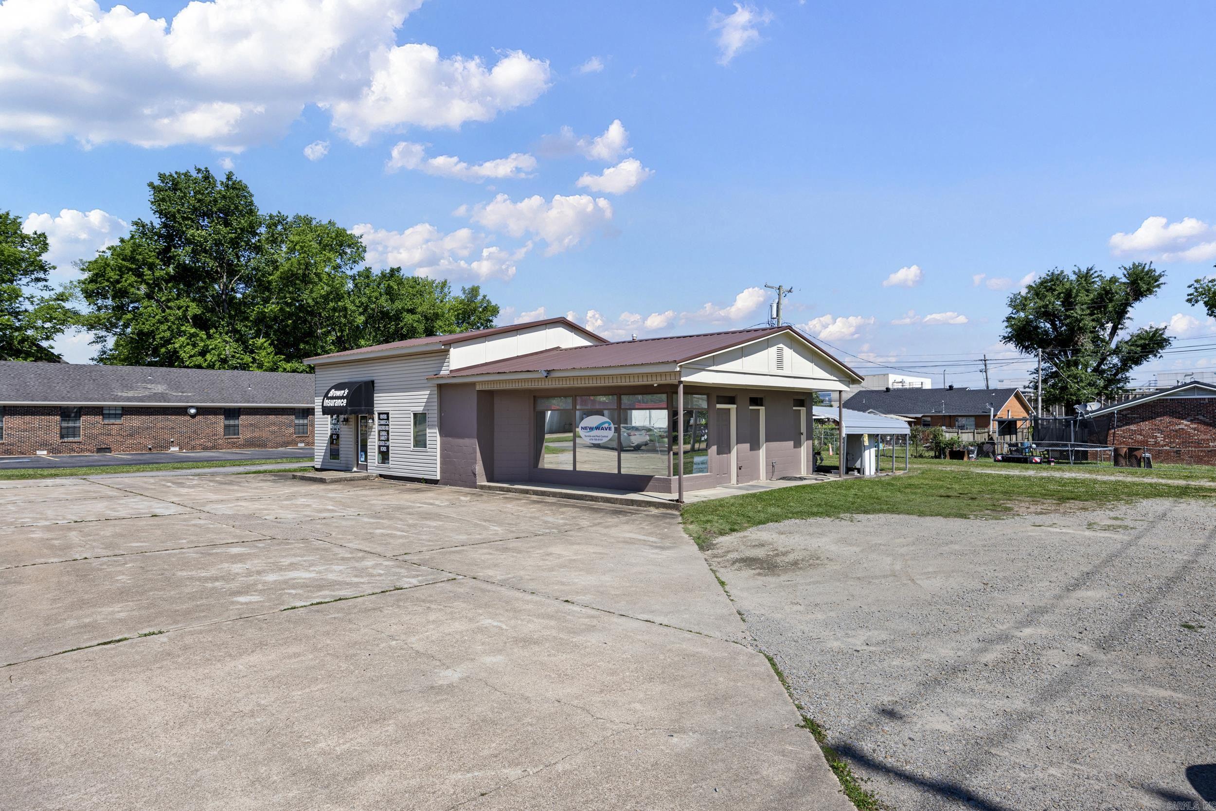 Commercial building located on Main Street in Clarksville offering excellent visibility and accessibility. Interior features include a kitchen area, bathroom, and shower, providing flexibility for a variety of business uses. Hot water tank was replaced in 2025. Roof replaced in 2020. Exterior was freshly painted in 2025.  Property also includes an exterior bathroom and an additional detached room that was previously a bathroom and could be converted back. Functional layout with multiple-use potential, ideal for retail, office, or service-based businesses.