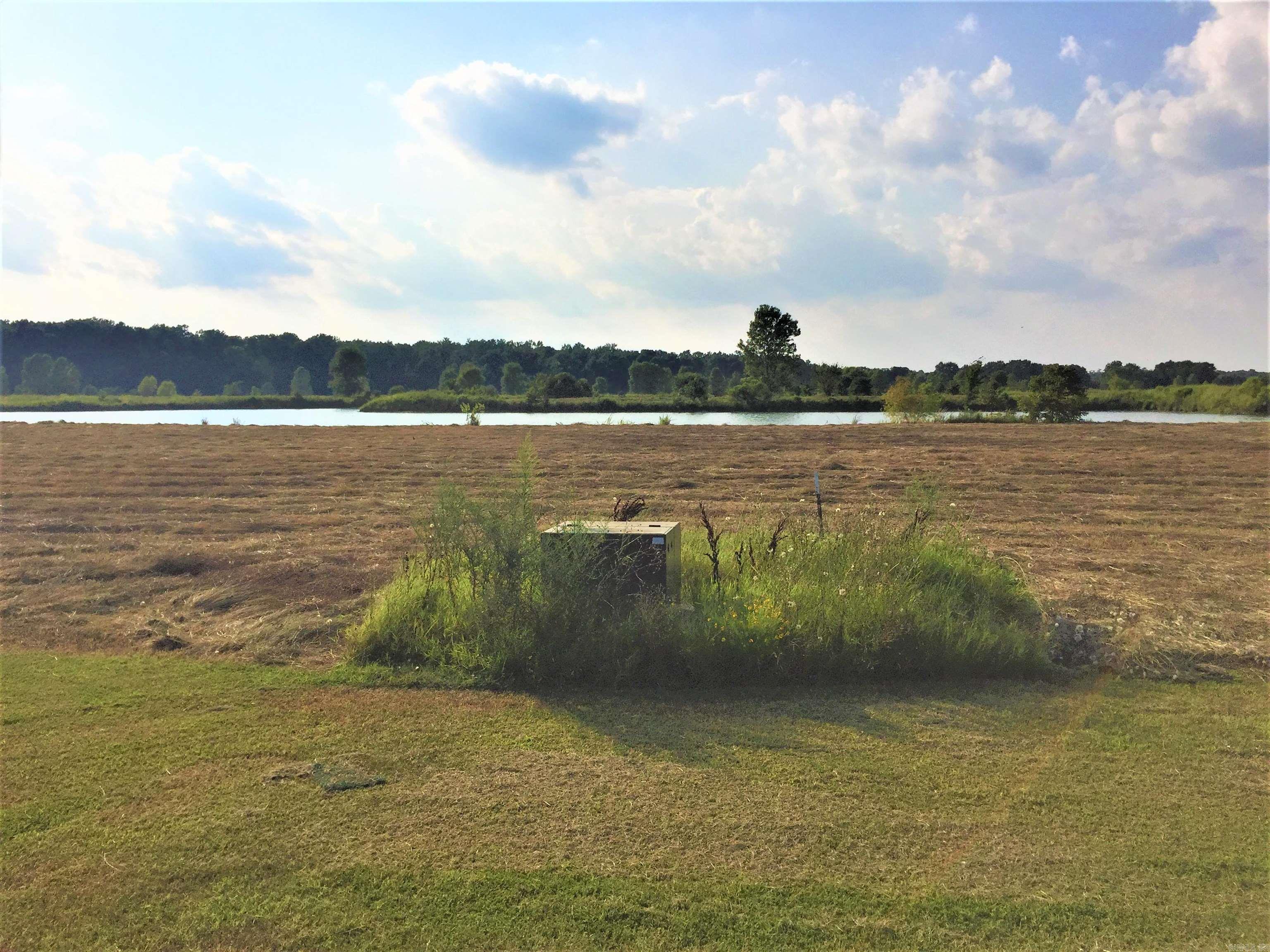 Come on out, and get a glimpse of what Lake life is all about. Lots big enough for the avid gardener and a Lake stocked for the avid fisher. Who doesn’t love from lake-to-table, from garden-to-table. Mound Lake Estates is a true hidden gem gated community, where everyone waves. An out of city limits feel but still a close commute to necessities. Restaurants, shopping, and grocery can easily be a 20-25 minute commute to North Little Rock, and about 15 minutes to England. Little Rock AFB about a 25 minute commute. Major distribution centers such as Lowes, Dollar General, Amazon, and Caterpillar Inc. about a 20 minute commute. These Lots are level with gas, water, and electric available. Community sewer available or septic, you get to make the choice. Bring your Builder and house plans. Architectural committee to approve house plans. Mound Lake is accessed by a 150 foot boat ramp for adventurous fishing or just boating to relax and unwind. Please see Agent Remarks.