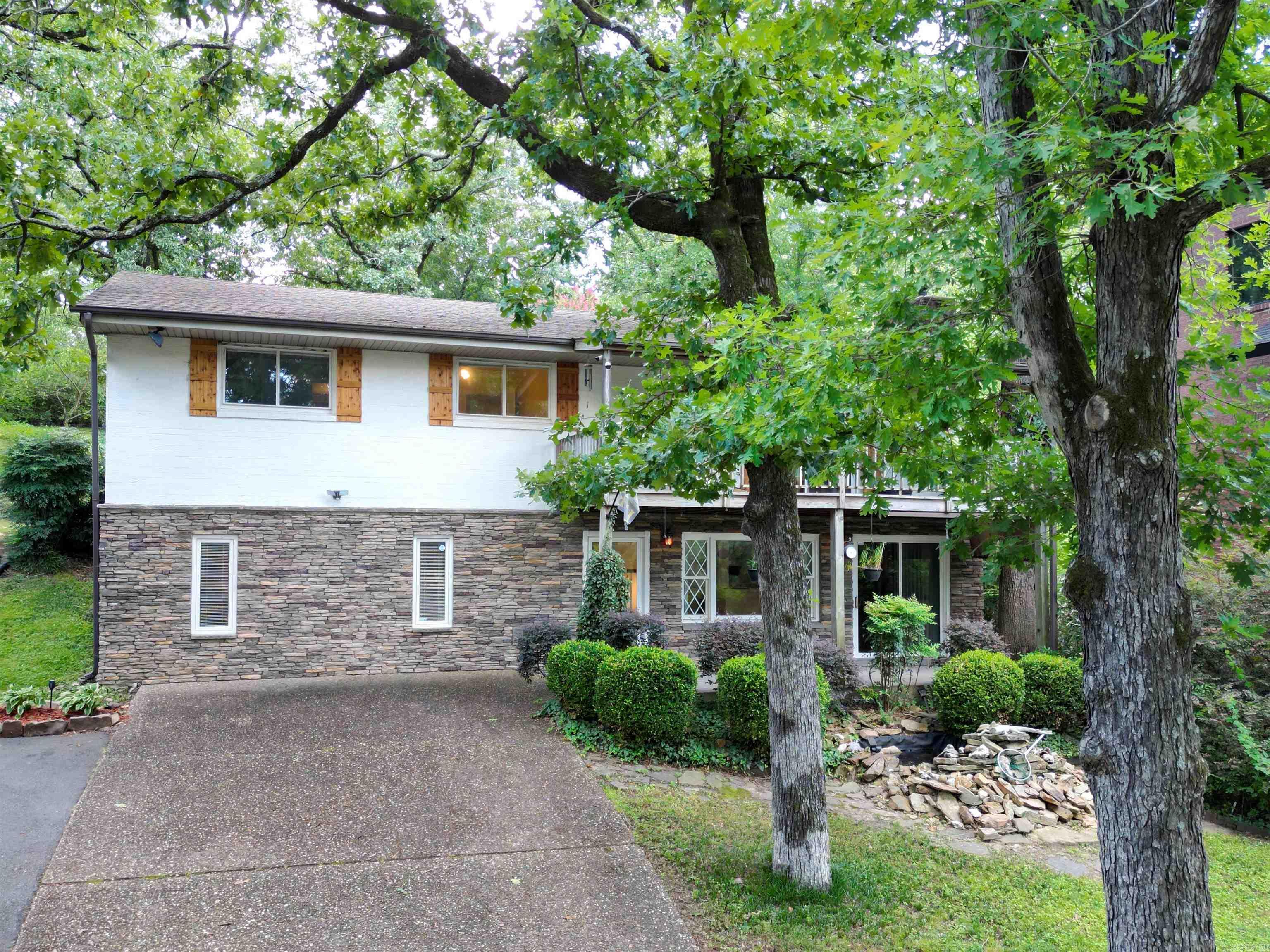 WHAT AN AWESOME VIEW!!  This waterfront 4-bedroom, 3-bath home is located on  Lakewood Lake, 1 of the Park Hill Subdivision. The front deck guarantees for much enjoyment  while you take in the amazing view.  The lower level has a den with a rock fireplace and dry bar, and a primary suite with a full bath.  The spiral stairway leads to the great room, kitchen, and dining room,  3 bedrooms, and 2 baths.  The 2 lots allow for an abundance of parking off the circular drive.   There is a 18 x 14 shop and a 8 x 10 storage building for all your extra storage needs. Don't let this one get away.  Make your appointment today!  Seller is offering a $5000.00 painting allowance.