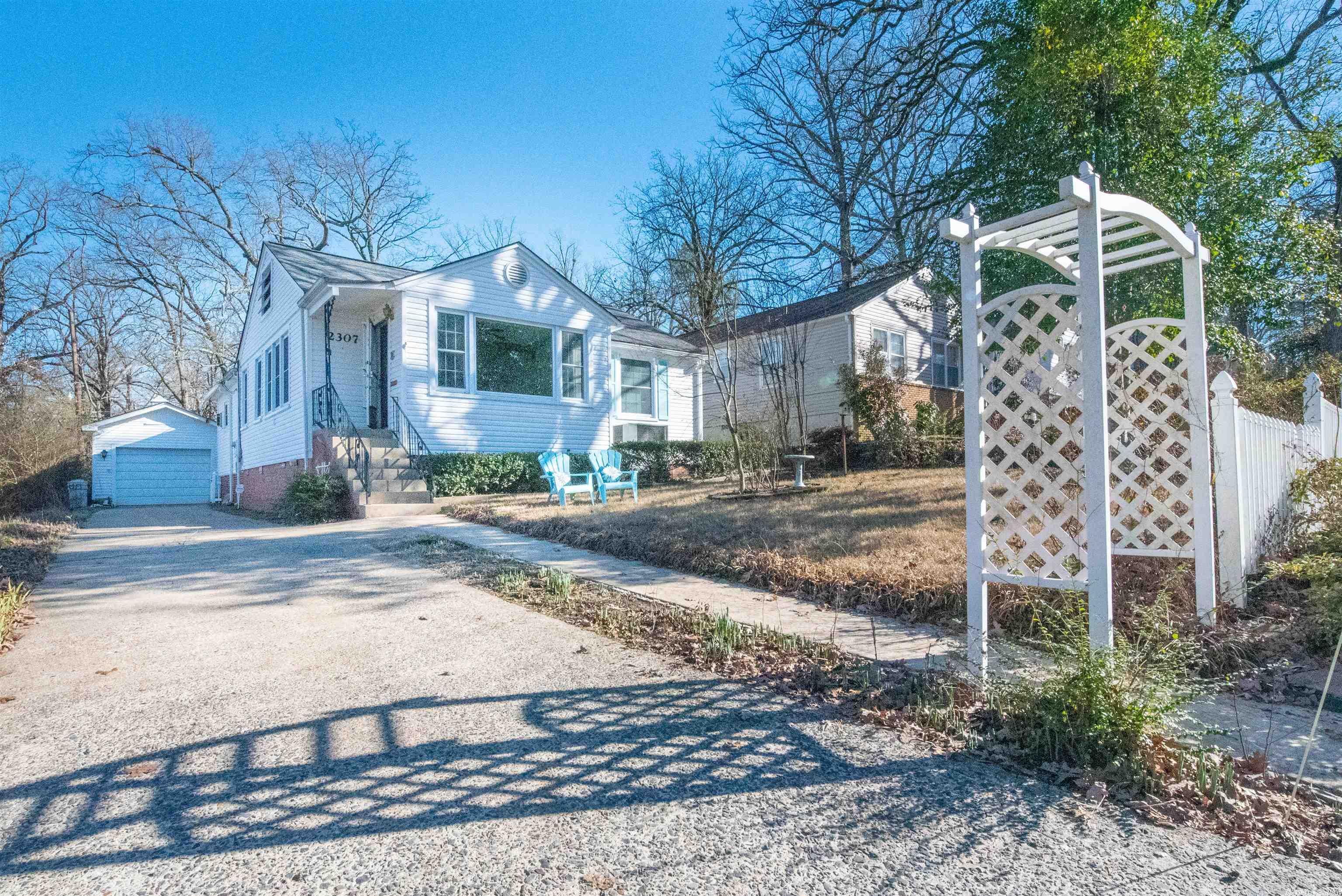 Spacious cottage style with rose covered picket fence. Oversized LR with built in bookshelves, DR, Laundry room. lg kitchen with eating space. several walk in closets, 3BR, 2 1/2 BA. Garage with small workshop, extra covered parking. High efficiency H/A, all windows vinyl fold down for cleaning, Ref, W and D as is. Home warranty provided. Quiet street, easy walk to UALR