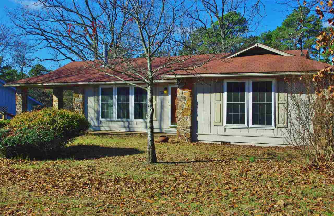 Live the good life in Fairfield Bay.  This 3 BR / 2 BA home is so easy to love, located in FFB Town Center.  Vaulted ceiling living room with wood burning stove, Master bedroom and dining room all lead to inviting sun room overlooking wooded area.  Light, fresh and move-in-ready.  Come check out this little treasure.