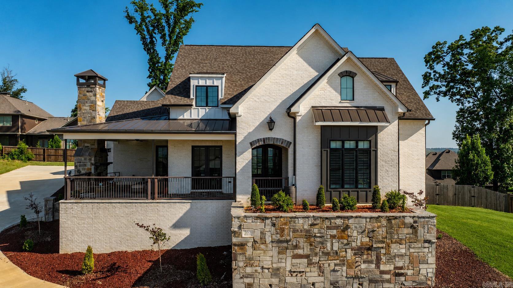 Absolutely stunning custom home with breathtaking river views, 4 bedrooms, 4.5 bathrooms, and 4,620 square feet of beautifully designed living space. The light-filled, open floor plan is perfect for entertaining, featuring a spacious living area that flows effortlessly into the chef's kitchen with top-of-the-line appliances and gorgeous finishes throughout. A large bonus room offers endless possibilities and could easily serve as a 5th bedroom, game room, or media room. Built with exceptional quality and energy efficiency, this home includes spray foam insulation, insulated concrete block construction, dual 26 SEER HVAC systems, Pella windows, and plantation shutters and roller shades throughout. Relax on the inviting front porch with its cozy fireplace while taking in the incredible river views. The premium security system provides peace of mind, and the oversized 3-car garage features an extra-tall third bay with a 60-amp hookup for a car lift or electric vehicle. Plus, the 642+ square foot unfinished space above the garage with its own mini-split is ready to become a guest suite, home gym, office, or whatever fits your lifestyle.