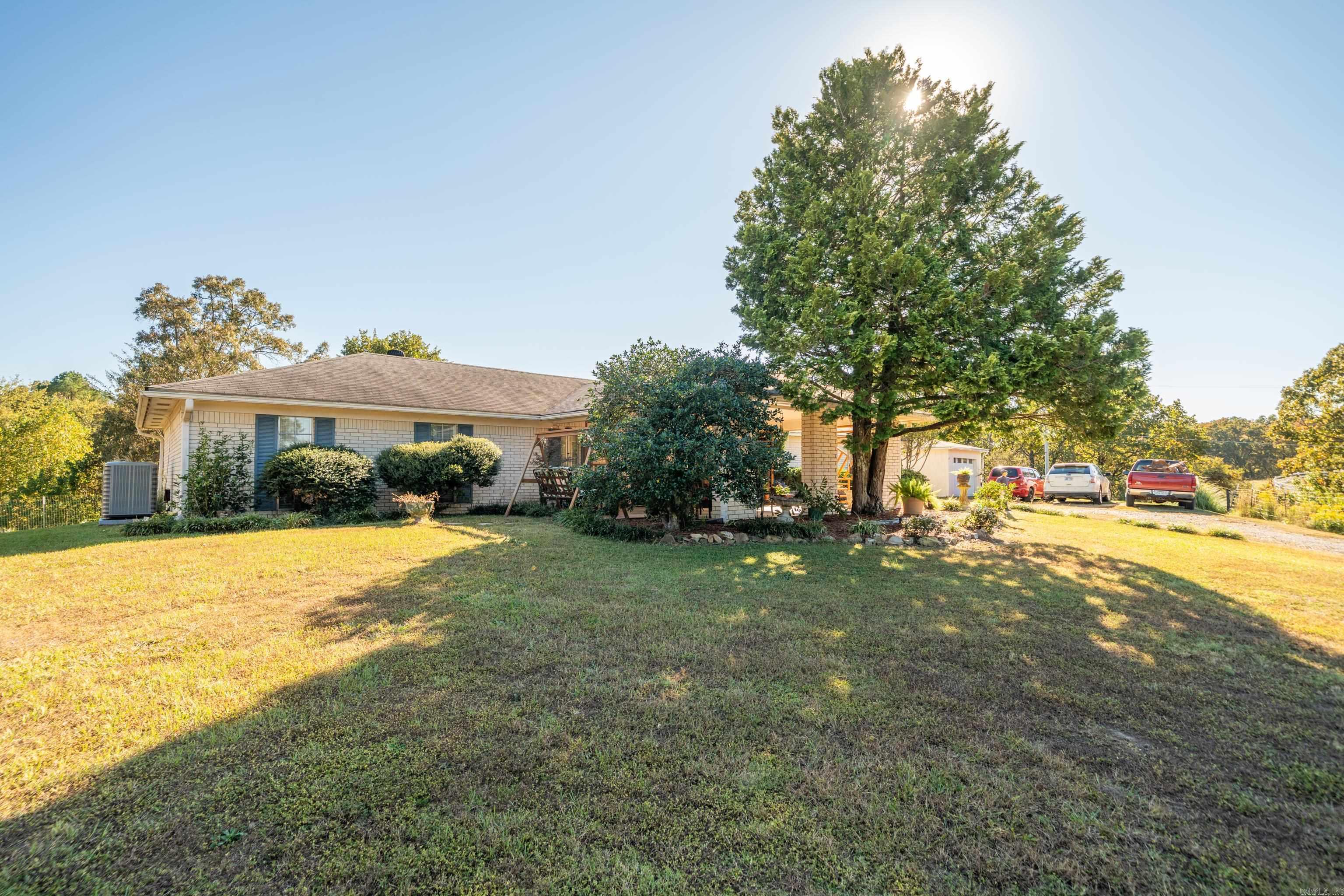 Charming One-Level Home on 4.25 Acres with Pond View.  Discover the perfect blend of comfort and countryside charm with this beautiful one-level home nestled on 4.25 acres in the Lake Hamilton School District.  Designed for easy living and outdoor enjoyment, this property offers plenty of space to roam and relax — with a fenced pasture ideal for horses with a run in shed, and a breathtaking view overlooking a tranquil pond.  Step inside to find inviting living spaces filled with natural light and serene views of the surrounding landscape. The single-level layout provides effortless flow and accessibility, making it perfect for everyday living or weekend getaways.  Outside, the property shines with wide-open spaces, mature trees, and a peaceful setting that captures the beauty of Arkansas living. Whether you’re tending to horses, enjoying a quiet morning coffee by the pond, or watching the sunset from your back porch, this home offers the tranquility you’ve been looking for. New HVAC / Warranty will transfer to buyer. New Luxury Vinyl Plank flooring.