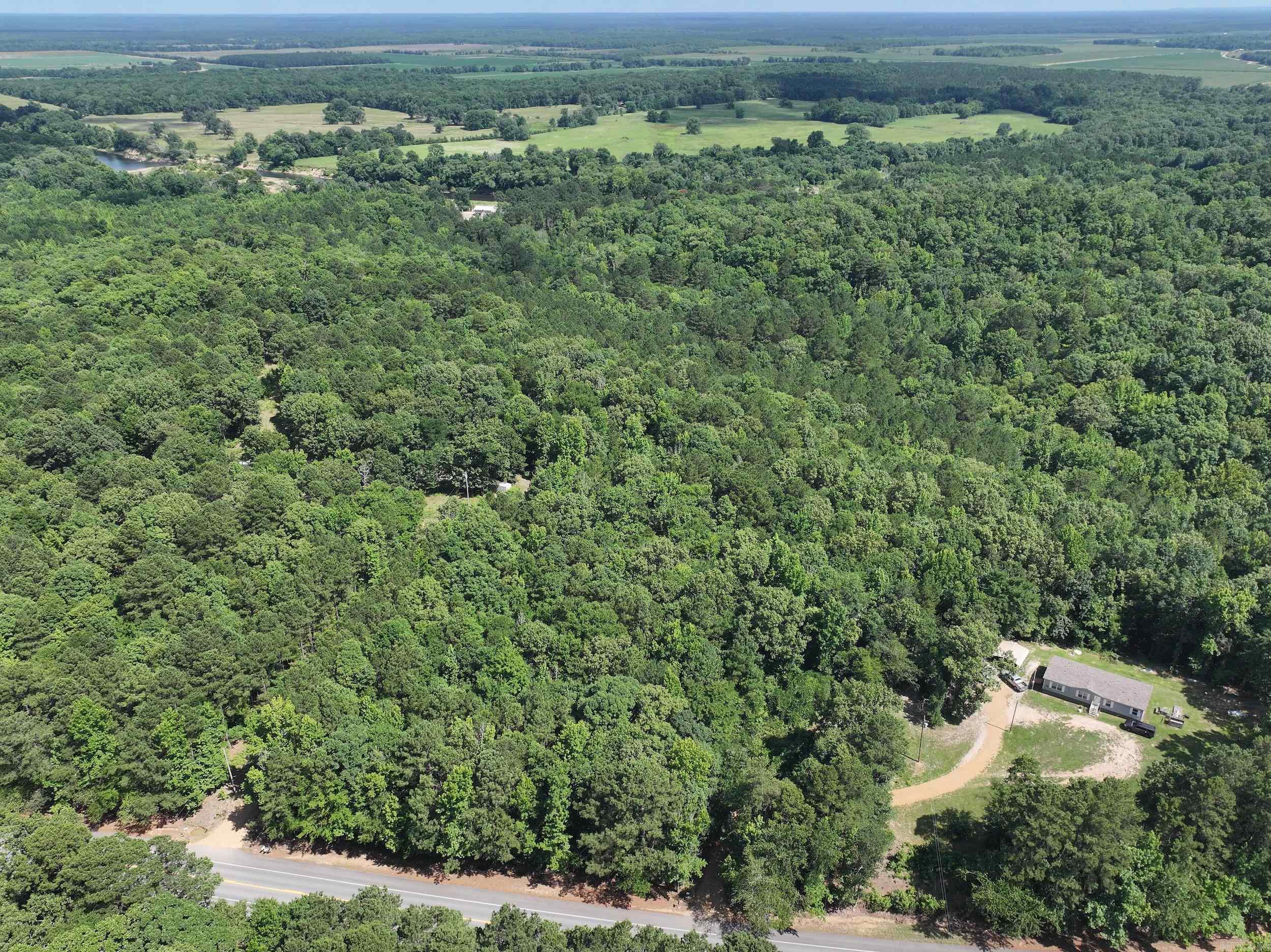 Discover the perfect combination of space, privacy, and convenience on this beautiful 25± acre wooded property in Caddo Valley, Arkansas. Located just off Interstate 30, this property offers easy access to everything the area has to offer. The property features existing utilities and a shop building, making it an excellent opportunity for a future homesite, weekend retreat, or investment property. The wooded landscape offers natural beauty and plenty of room to create your vision. One of the property's biggest advantages is its proximity to Hot Springs, with shopping, dining, entertainment, medical facilities, Oaklawn Racing Casino Resort, and historic Bathhouse Row all just a short drive away. Enjoy the convenience of city amenities without sacrificing the tranquility of country living. Outdoor enthusiasts will also appreciate being near Lake DeGray and the Caddo River, offering endless opportunities for boating, fishing, kayaking, and enjoying the natural beauty of Arkansas.