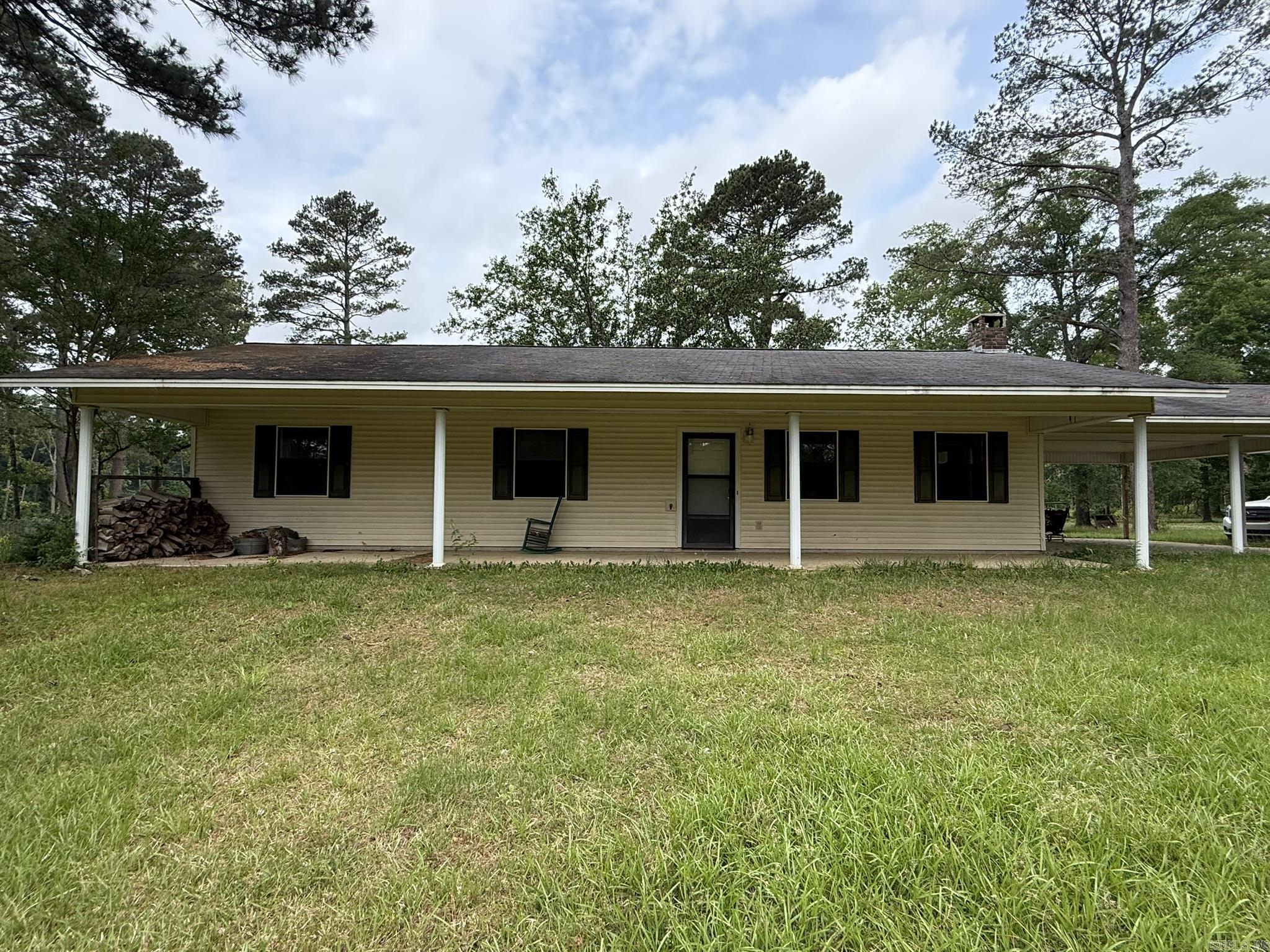 Perfect country setting west of Nashville.  This property offers approx 6 acres with a 3 bedrooms 1 1/2 bath home, including a spacious kitchen: stove, refrigerator, and dishwasher to convey, large living area with wood burning stove, oversized laundry room and a double carport.  Home is all electric with CH/CA, newer hot water heater, rural water and a well.  Property offers a mix of open pasture, nice pond, and space, including several out buildings, a small cabin and barns.