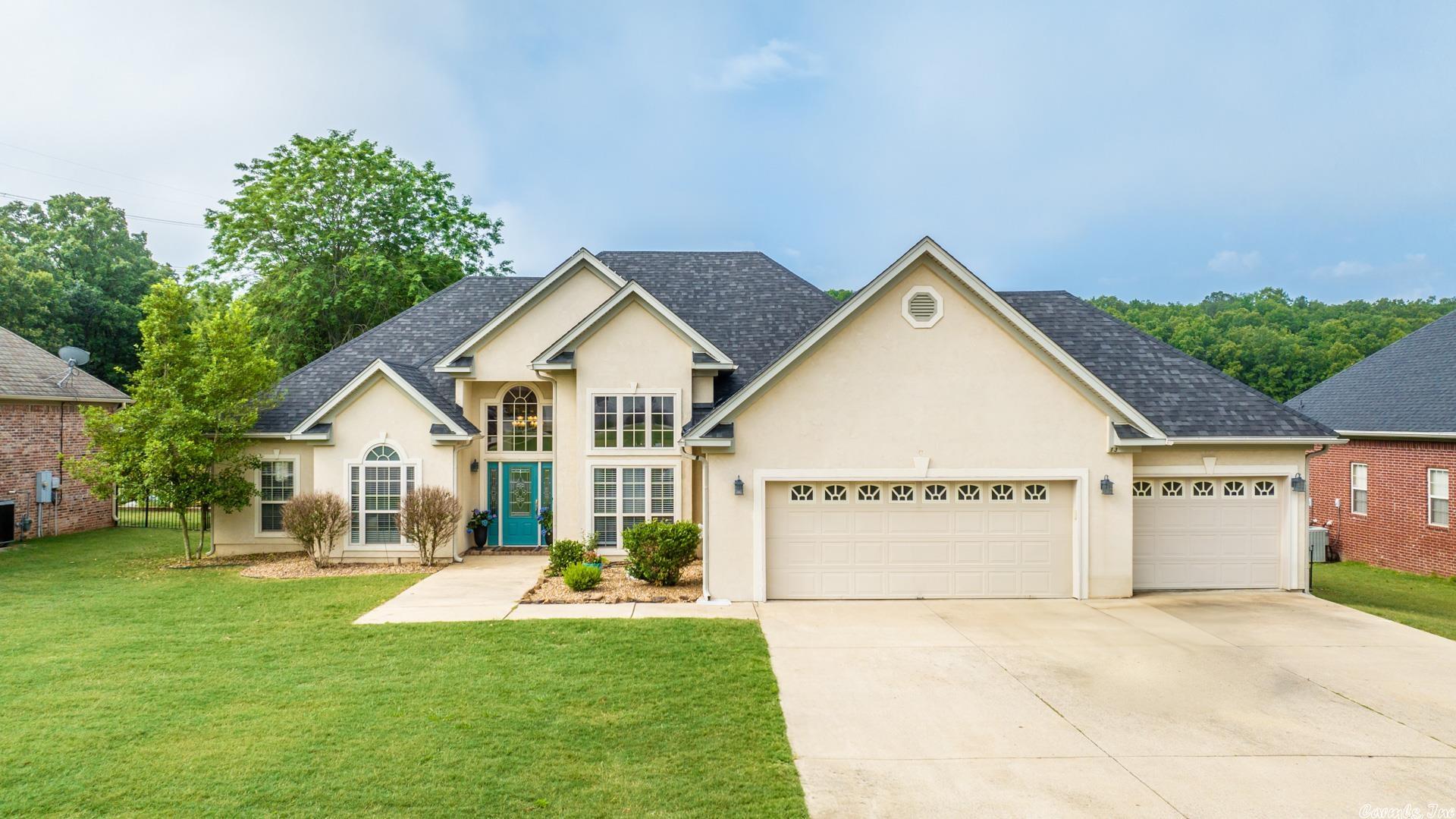 Wonderful 3/2 home setting on the back 9! This stucco home is just what you're looking for! Tall ceilings, new paint & 3 car garage. This split floor-plan home has a large master bedroom that features a sitting area big enough for a small office space. The master bathroom features his & hers vanities, large center tub, & shower. Kitchen/Breakfast combo & separate formal dining area. Fireplace in living area. Then step outside to your covered back patio that features a first class view of the back 9!
