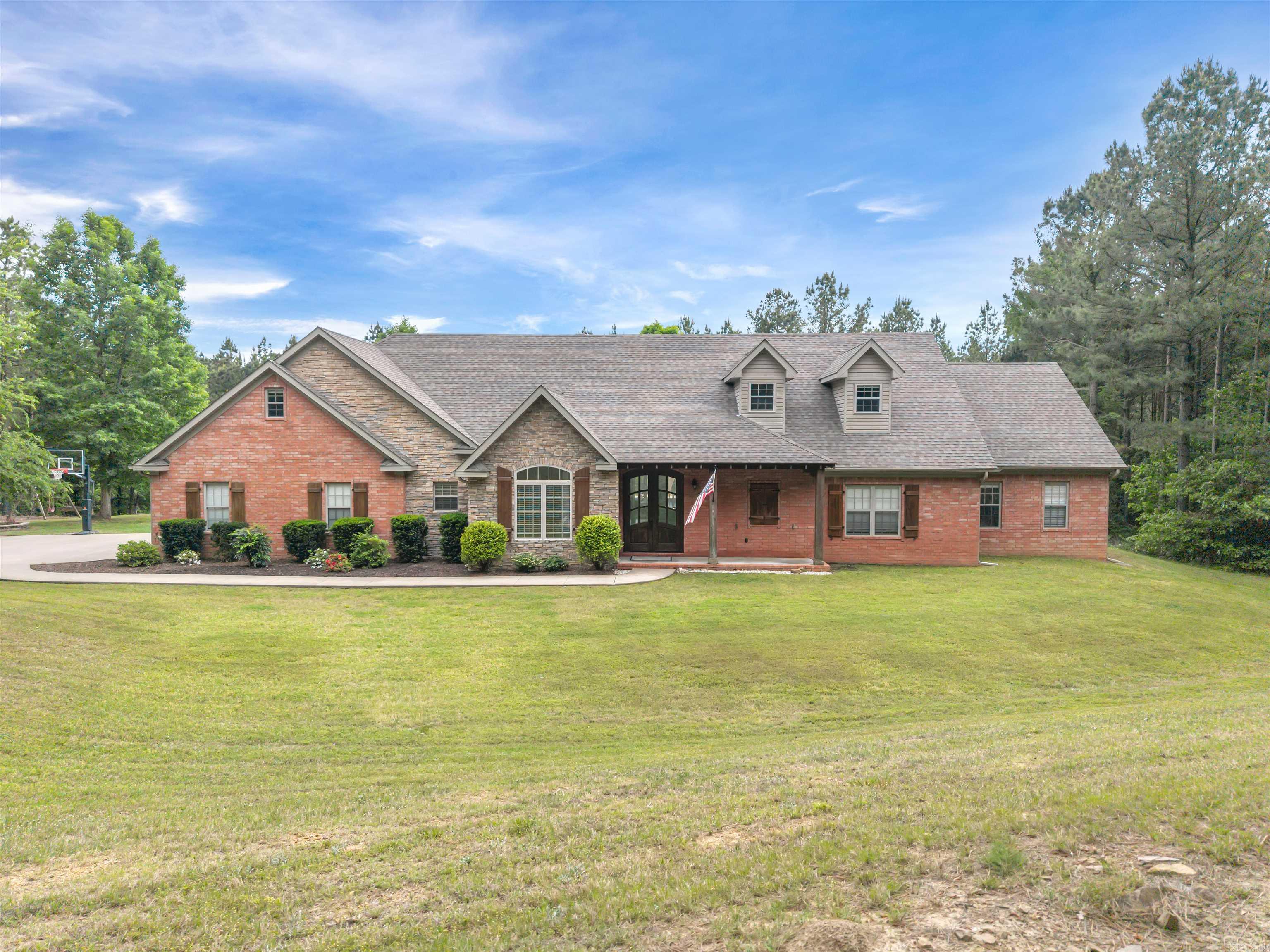 Tucked away in the Ouachita National Forest and Winona Wildlife Management Area, this custom home sits on 9.87 acres in a rural, country setting! Enjoy the convenience of being within 35 minutes to Conway and Little Rock, but the privacy of country living. The NEW in-ground pool is PERFECT for entertaining! The deck has been reinforced and wired for a hot tub! Inside the home features 4 bedrooms, 3.5 bathrooms, great room and a bonus room! All closets are generously sized, with the master being a huge walk-through closet. The custom kitchen features quartz countertops, an induction cooktop and convection oven, with a HUGE walk-in pantry. The main living areas feature 12' ceilings with rich crown molding and custom blinds. The home features 16 SEER HVAC units, newer roof with 30 year architectural shingles and LVP flooring - 2022. The home has an oversized garage and a 20x30 detached garage/shop, which features a full bathroom, washer/dryer hookup and electrical. New in-ground basketball goal makes a nice feature for families! *Fiber Internet & City Water* Seller requires agent to have pre-approval letter on file or proof of funds prior to showing.