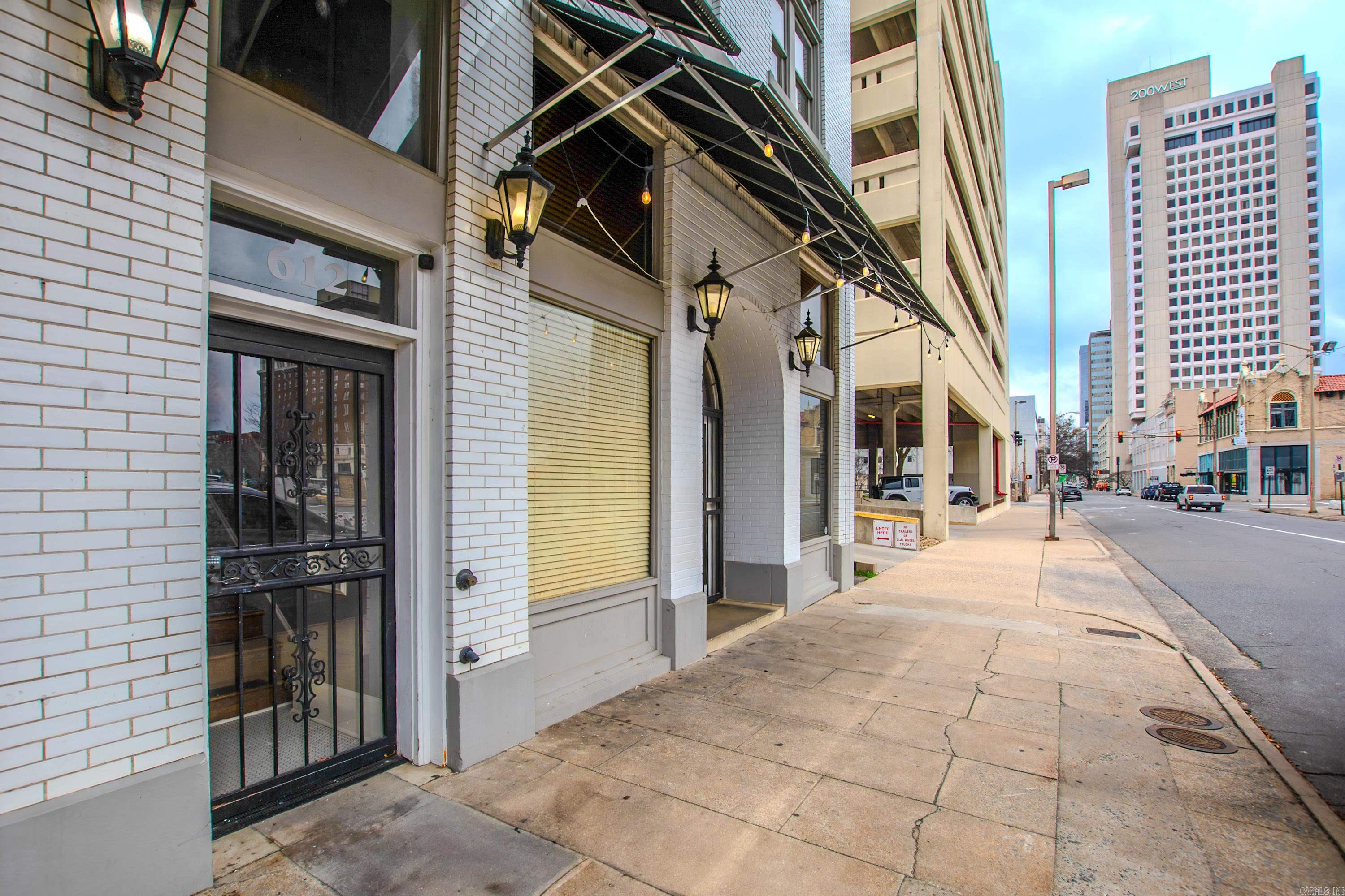 Welcome to a beautiful blend of historic, architectural design, fabulous contemporary decor and a loft-style living reminiscent of New Orleans French Quarter.  This one bedroom, one bath apartment with outdoor patio area is spacious, convenient and comfortable.   Here's a great opportunity to live in downtown Little Rock and have an apartment that is fully furnished - and I emphasize FULLY furnished!  This unit not only includes furniture, TV, appliances, washer and dryer; the kitchen is fully equipped with a Keurig, dishes, glassware, pots, pans, cookware and utensils.  Bed linens, and bath towels are also included.  Water, trash pick-up and a designated, paid parking space are also included.  Bring your clothes and you're set!  Lease required.  Call today to schedule a tour!  Not pets allowed.  *Agents Review Remarks*