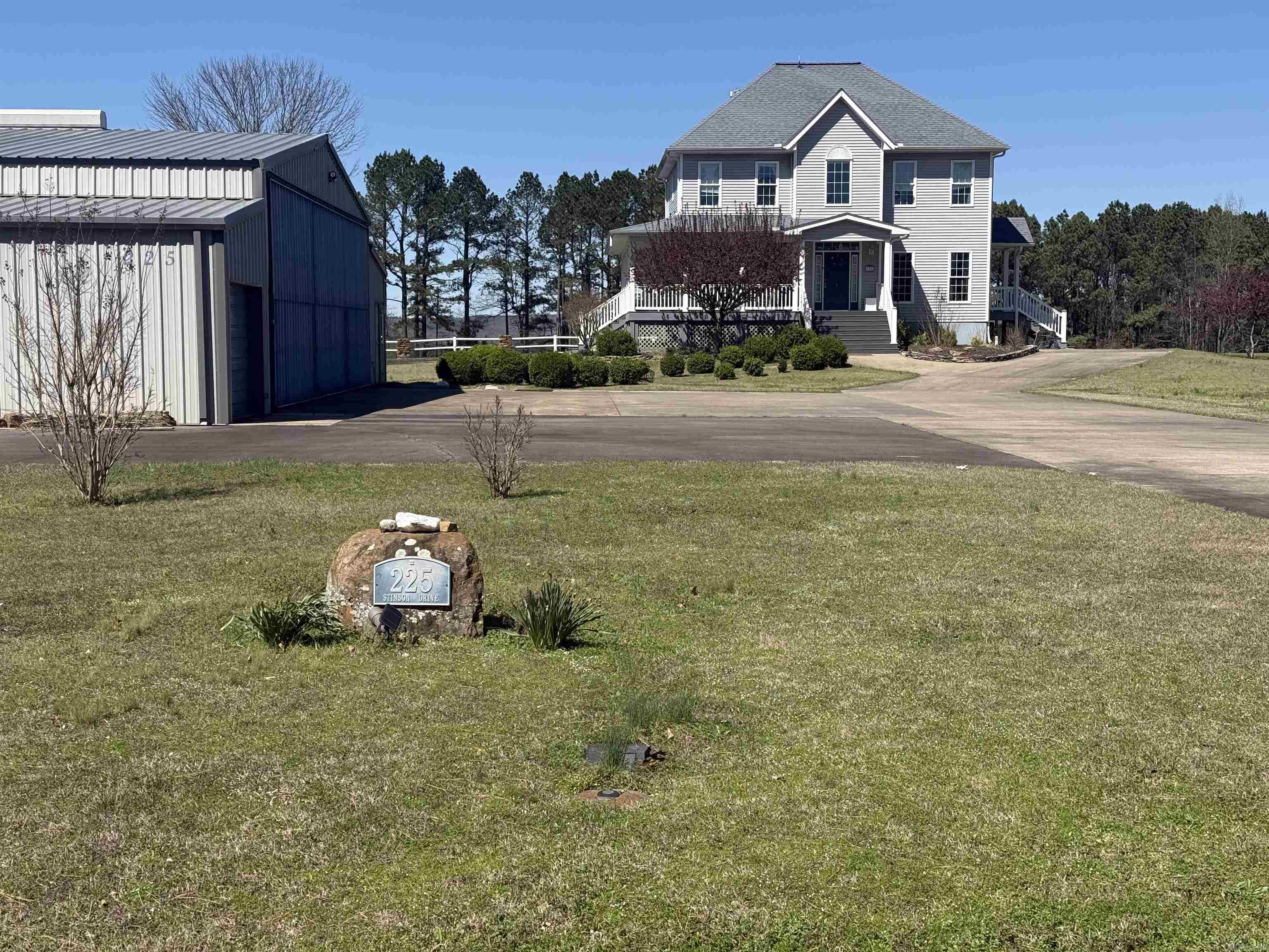 Live the dream where your home is steps from the runway! This amazing home sits halfway down the runway at Holley Mtn Airpark. A premier gated residential airpark. This home features expansive porches and strategically placed windows offering views of takeoffs and landings from nearly every room! It has a 40 ft deep x 50 ft wide hangar, with an additional 12ft overhang on each side. One side is a garage with electric roll-up door, and the other side is a fully functional 680 sqft apartment. The hangar door is 46 ft wide and 11 ft 3 in high.  There is direct taxiway to the beautifully maintained paved runway that is 4800 ft x 50 ft with two GPS approaches and pilot-controlled lights. This home is just minutes from Clinton and 20 minutes to the crystal-clear waters of Greers Ferry Lake. Holley Mtn Airpark combines aviation convenience with the natural beauty of the Ozark Mountains- hiking,fishing,boating, and more are right at your doorsteps. Schedule your private showing today!  See agent remarks.