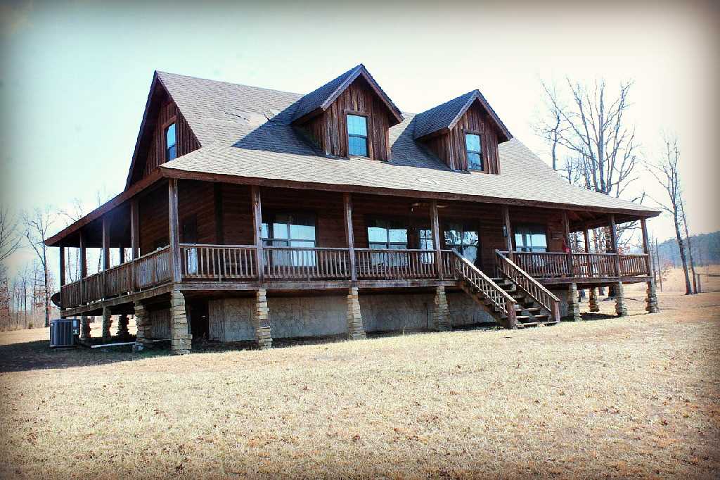 No.01729 – Cabin For Sale in the Ozarks – Come see the Ozarks and fall in love with this cabin. This property has everything that tugs at your heart strings. It’s a place that you will want to raise your family in. The cabin has 4 bedrooms, 2 bathrooms, and 1,440 square feet. There is a wrap around porch on all four sides, mountain top views, wood stove, central heat and air, family room, and den. The cabin is currently set up for a nightly rental and comes fully furnished. $149,000