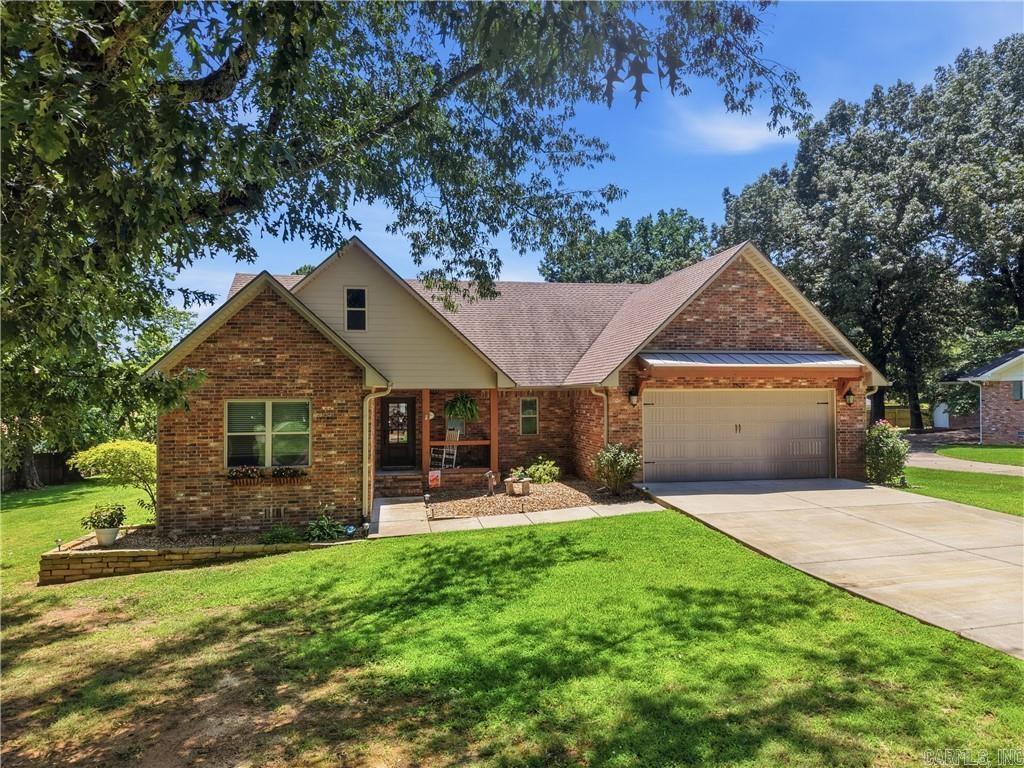 Immaculate, inviting, and filled with natural light, this beautiful all-brick home offers over 2,000 SF of thoughtfully designed living space on the desirable west side of town. From the moment you step inside, you'll be welcomed by an expansive cathedral ceiling that creates a stunning sense of openness in the living room, while large windows fill the home with sunshine and warmth. The open-concept layout seamlessly connects the living room, dining area, and spacious kitchen, making it perfect for everyday living and entertaining alike. The kitchen features a wonderful center island, abundant workspace, and room for gathering with family and friends. Three spacious bedrooms, two full baths, and a convenient half bath provide plenty of room for everyone. Step outside and enjoy the awesome covered back deck, the perfect place to sip your morning coffee, host cookouts, or unwind after a long day. Meticulously maintained and truly move-in ready, this home offers the perfect blend of comfort, style, and functionality!