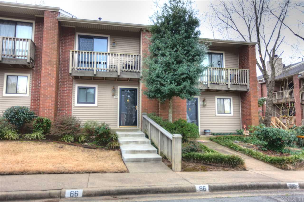 Great midtown condo convenient to shopping, restaurants and entertainment.  Many, many updates including SS appliances, wine cooler, hardwoods, new carpet lighting and bath fixtures.  Great room features wood burning fireplace and wet bar. Both levels have access to wood decks with beautiful view of pool. Wonderful North/South exposure assures comfortable outdoor living..lots of storage, security system..POA fee pays water,termite, landscaping,ext maintenance & insurance.  Carefree living at its best!