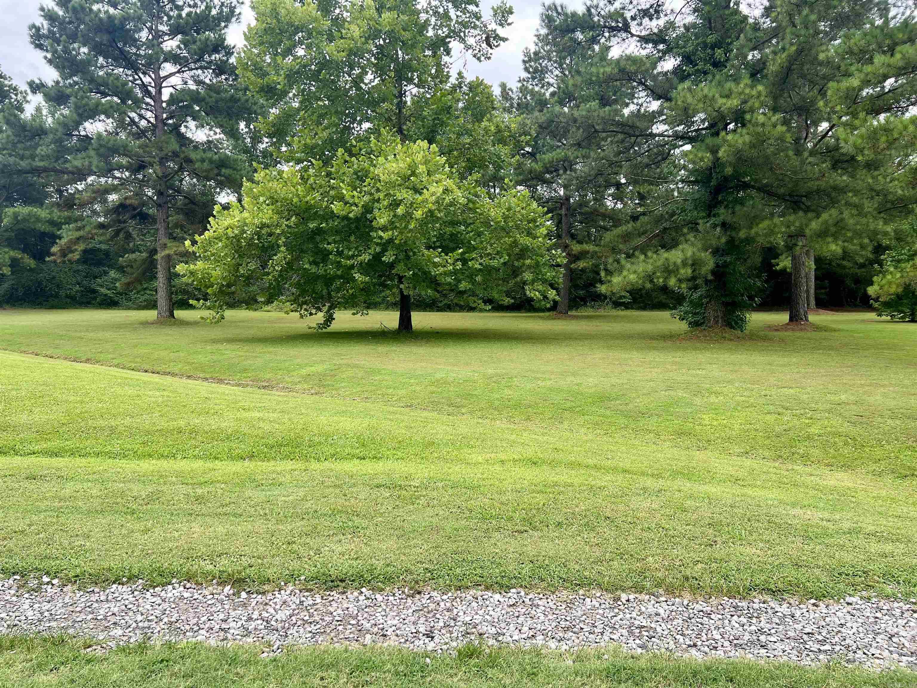 1 acre tract, no utilities established but all available for set up. No mobiles, mineral rights do not convey. 1200 sq ft minimum build deed restriction.