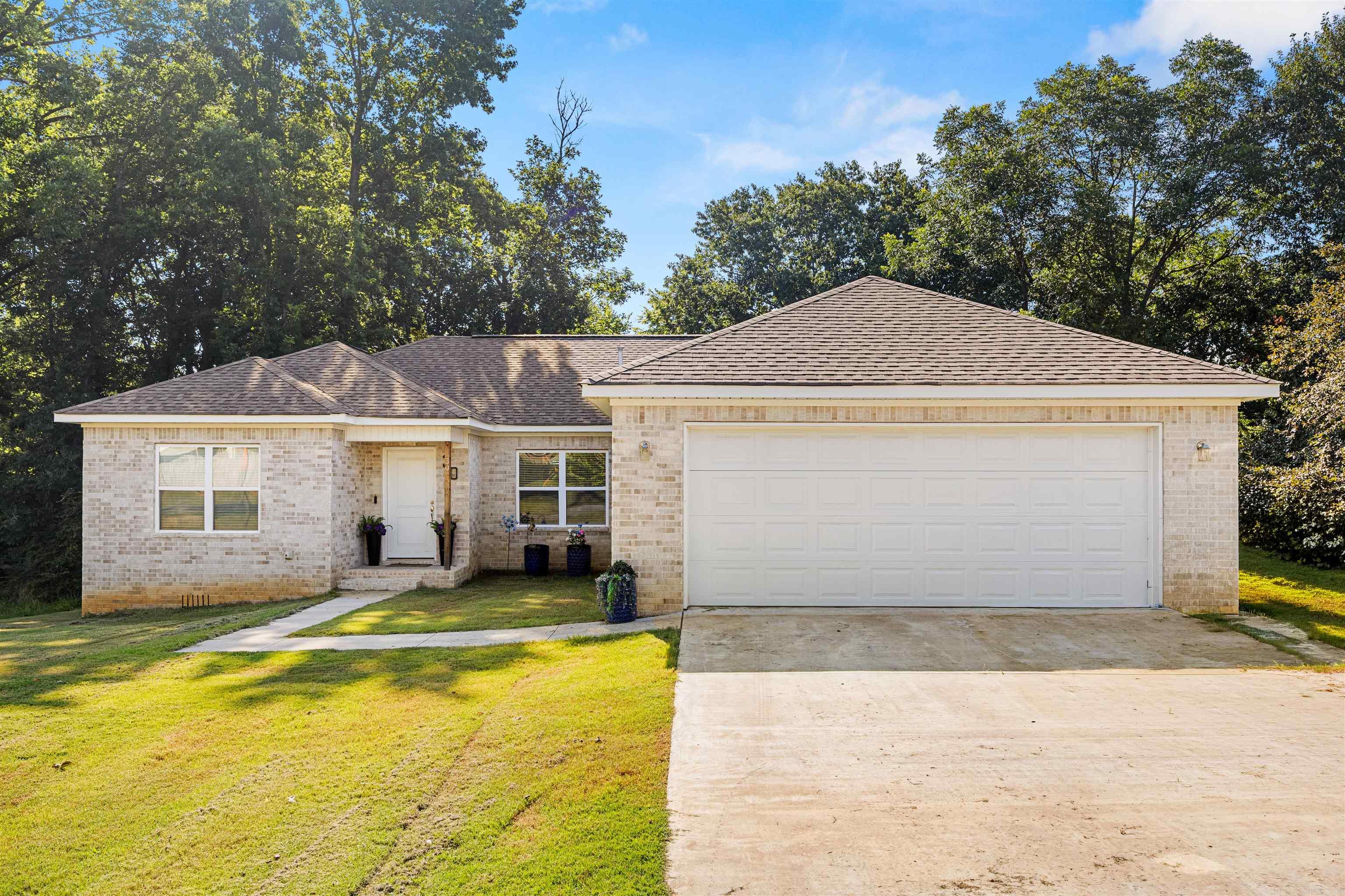 Beautiful all brick new construction on an oversized lot. All doors are 36" wide for ADA compliance. Minutes from everything. LVP throughout. Tile in the bathrooms and laundry. NO CARPET. Custom quartz countertops throughout. All cabinets and shelving are custom built. Stainless steel appliances. Large deck for entertaining.  All electric for easy maintenance. 1 year builders warranty. Area is approved for Rural Development $0 down loans.