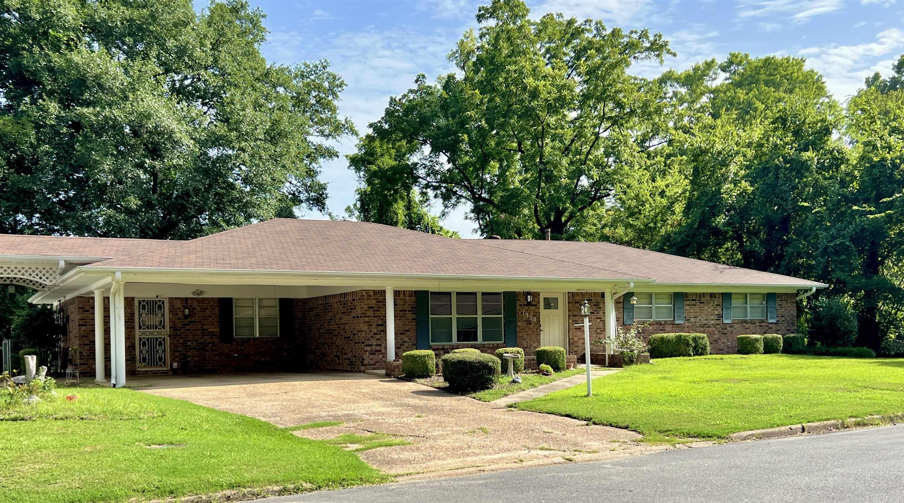Move right into this beautifully updated 3-bedroom, 2-bath brick home offering approximately 2,310 square feet of inviting living space! Fresh interior paint and stylish tile flooring provide a bright, refreshed feel, while the spacious floor plan offers plenty of room to relax and entertain. The sunroom is the perfect place to enjoy your morning coffee, unwind after a long day, or take in views of the peaceful backyard. Outside, you'll appreciate the detached shop with endless possibilities for hobbies, storage, or a workshop, plus dedicated RV parking for added convenience. A small creek meanders along the back of the property, creating a tranquil setting with a touch of nature. Conveniently located just minutes from Henderson State University, Ouachita Baptist University, shopping, dining, and medical facilities, this home offers the perfect combination of comfort, updates, and location. Don't miss your opportunity to make this exceptional property your next home!