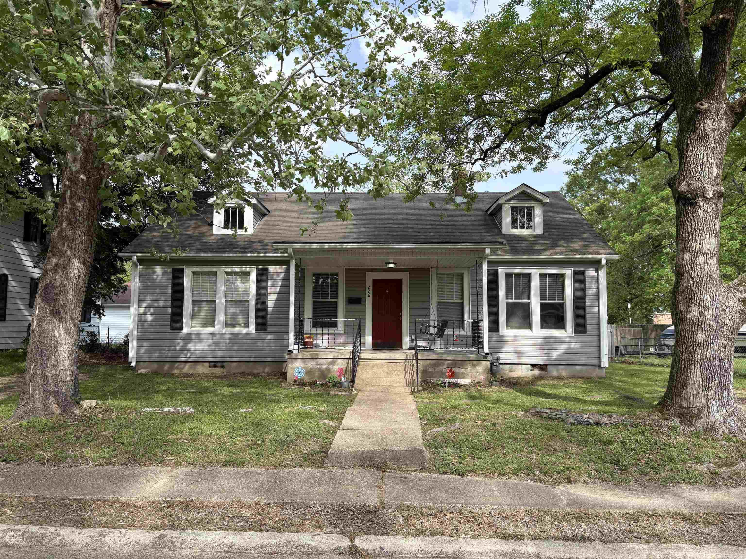 CHARMING AND CUTE AS CAN BE! 3 BR/2BA, 1408 sq ft, with 9 ft ceilings, tons of trim and crown molding all within walking distance of Henderson State University! Gleaming hardwood floors throughout living area, dining room, and bedrooms with Vinyl in bathrooms sand kitchen. Laundry area is spacious and off the kitchen with easy access to the fully fenced back yard with gates on each side. 2 driveways for extra parking and guests. New Roof in 2018. Call today, see for yourself, come sit and relax on the front porch swing.