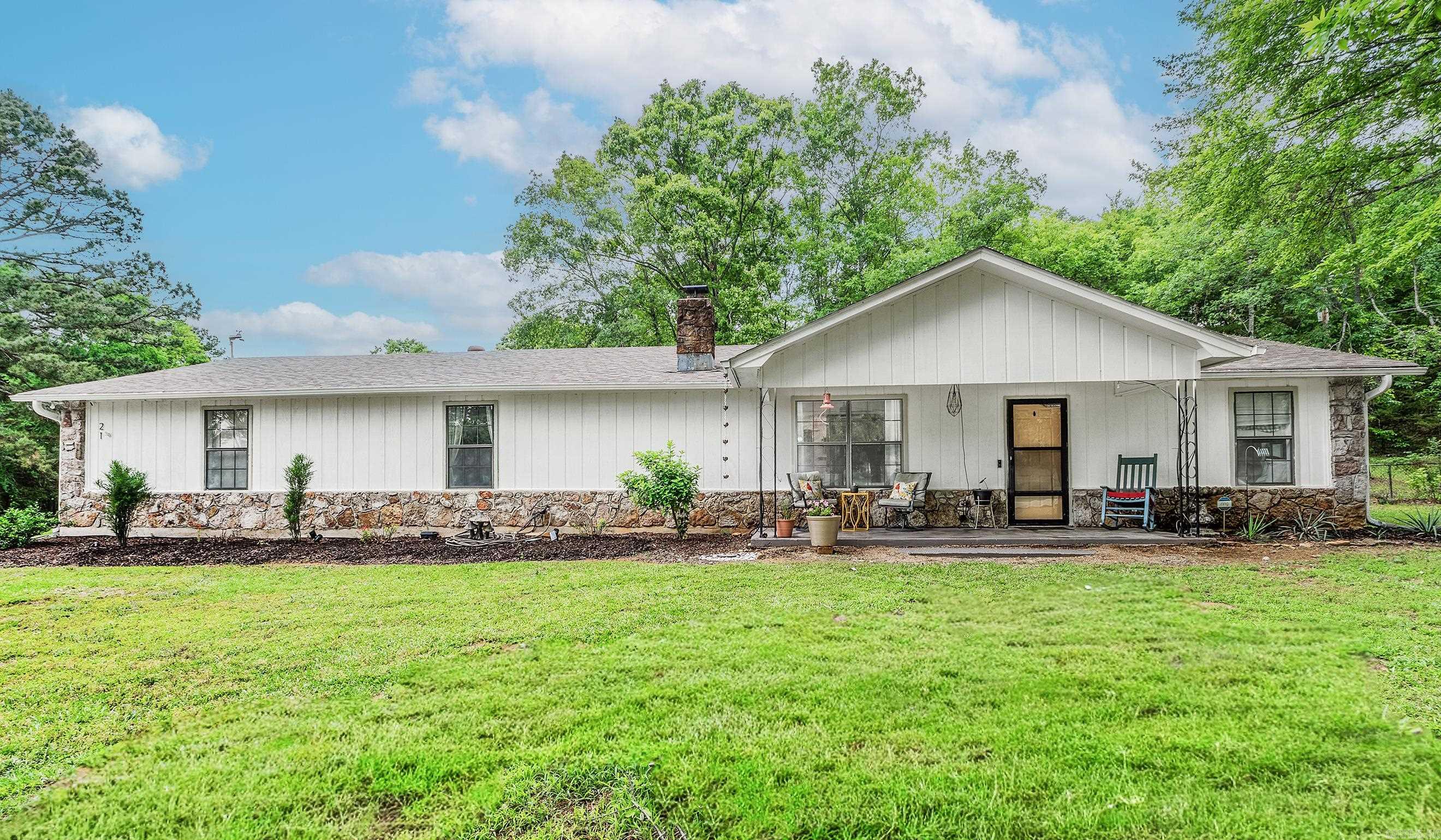 Pictures don't do this one justice, you'll have to see it in person!  Welcome to 21 Springhill, a completely remodeled 3 bed/2 bath on 3 peaceful acres outside Greenbrier city limits. You will feel right at home as soon as you walk in.  The original character and charm of the home is still there, with modern upgrades throughout.  Outside you'll find a spacious tree lined front yard, a fully fenced section in the back with a covered patio and gorgeous landscaping, and a set of raised garden beds to the side.  The back of the property is wooded, providing an added layer of privacy and ample opportunity to view wildlife.    Despite the rural feel, this home is less than a 10 minute drive from grocery stores, schools and restaurants in Greenbrier city limits, as well as other local amenities like Beaverfork Lake, Wooly Hollow State Park, and Persimmon Ridge Resort - a top rated disc golf course.    Whether this is your first home or your last, 21 Springhill has a little something for everyone.  *Showings to start Sunday, May 3rd.
