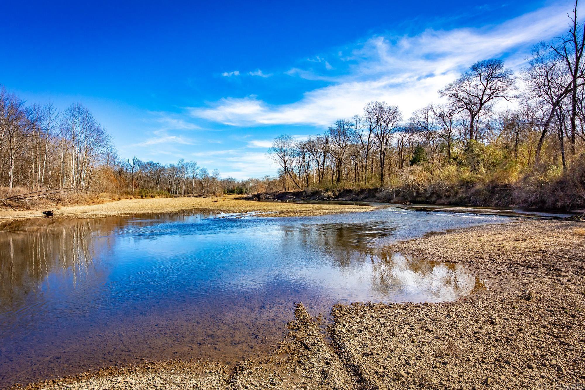 Approximately 90 acres of recreational and hunting land located along the Little Missouri River. Property offers river frontage with scenic views and abundant wildlife, including deer, wild hogs, ducks, turkey, and other small animals. Features include a sandbar that may allow vehicle access depending on river conditions. Ideal for hunting, fishing, swimming, canoeing and other recreational use. see agent remarks.