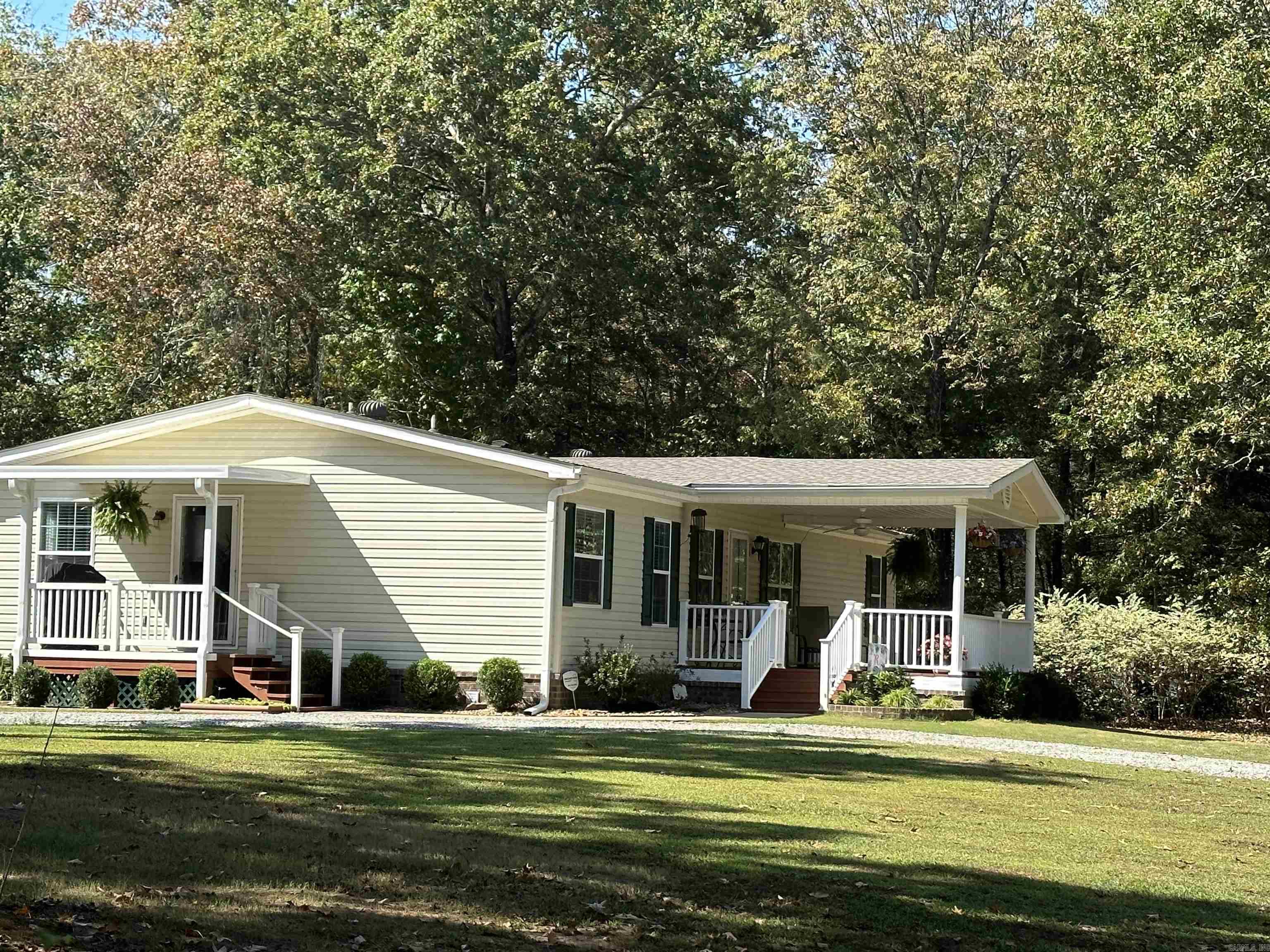 Welcome to your tranquil riverside retreat! This beautifully maintained manufactured home offers a perfect blend of comfort, convenience, and natural beauty. Located directly across from the picturesque Little Red River and situated on not one, but 2 spacious lots, this property is a slice of Arkansas paradise. Features 4 bedrooms, 2 baths, fully equipped kitchen, open floor plan, covered parking and a detached 4 car garage.   Separate garage/apartment is also included with separate electric, septic and plumbing.  Whether you're seeking a peaceful escape from the city or a year-round residence, this property is equipped for all seasons and join a welcoming community of river enthusiasts who share your love for the great outdoors.  Look today — this will not last long!