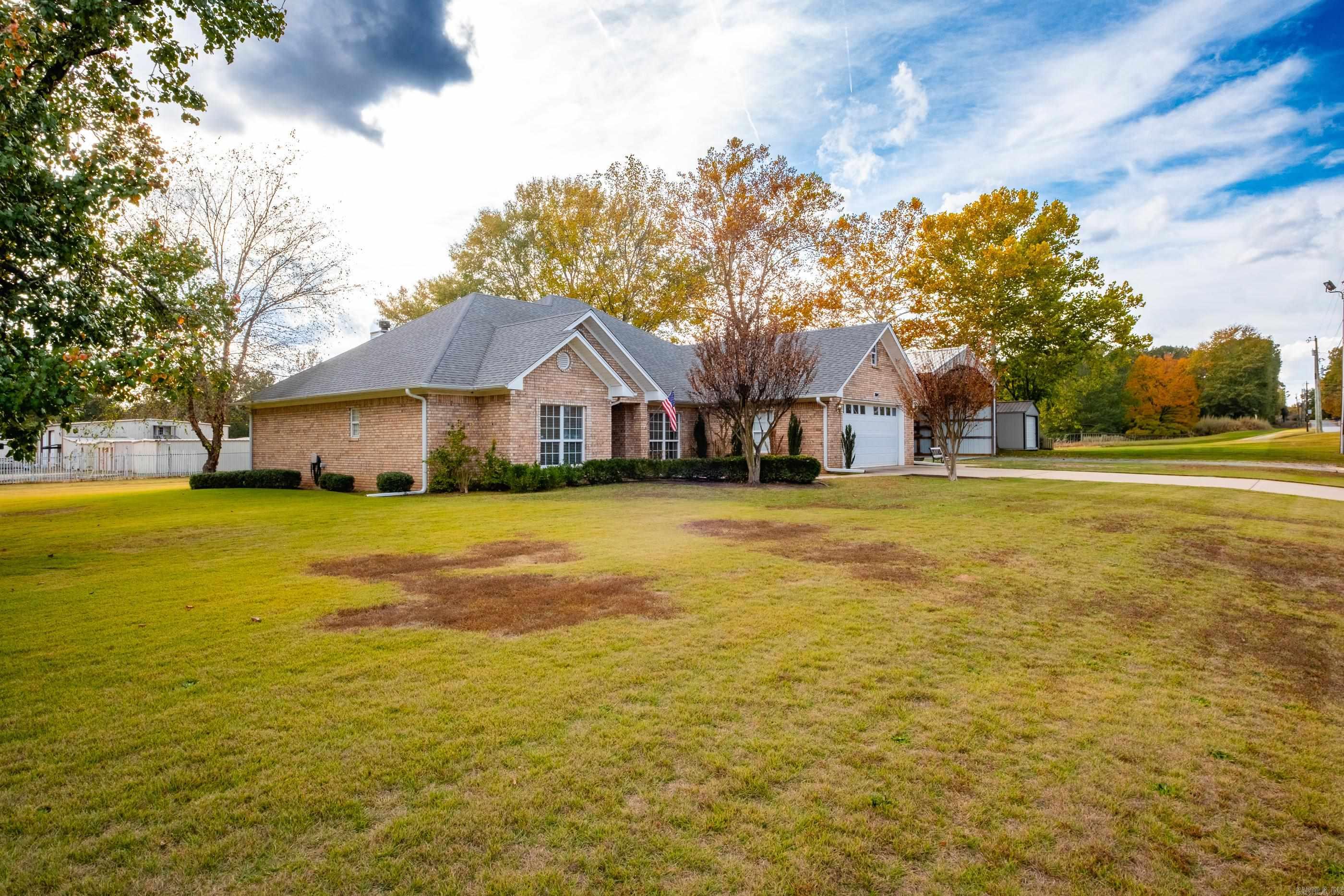 Discover the ease of single-level living on 1.58 private acres. This inviting 3-bed, 2.5-bath home welcomes you with a generously sized living room and a spacious primary suite complete with oversized walk-in closets. The Laundry Room is also a storm shelter. Step out onto the beautiful covered back porch—your new favorite spot for morning coffee or evening gatherings. For hobbyists, entrepreneurs, or anyone needing extra space, the expansive shop offers endless possibilities. A rare blend of comfort, acreage, and functionality all in one property.  Adjoining .92 acre could be sold as well. SEE AGENT REMARKS