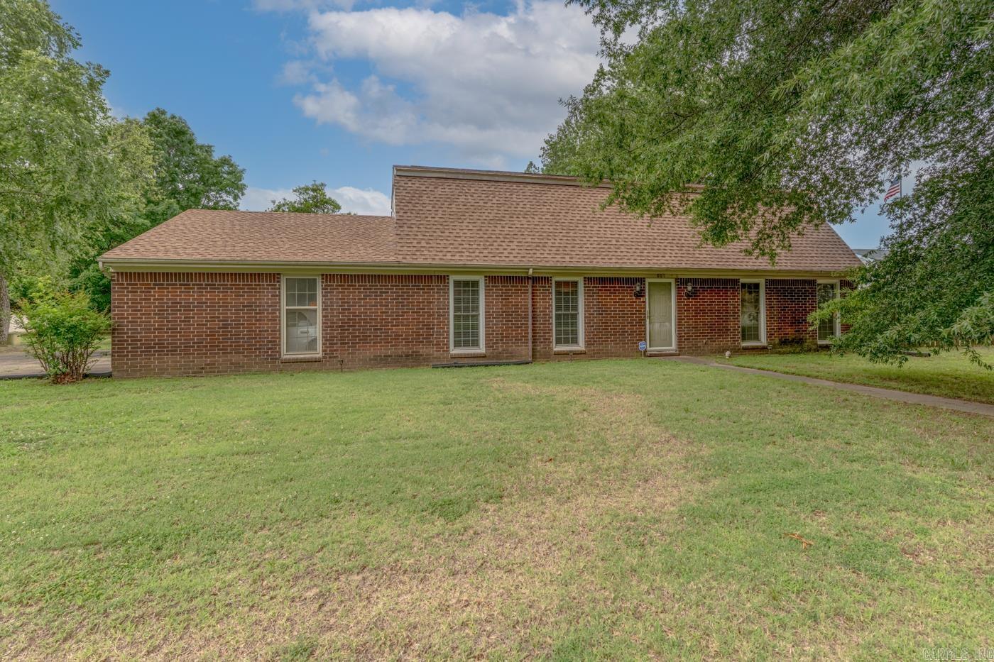 Welcome to Market 601 W Stroud St. in Jonesboro, AR within the Melton 1st Subdivision and the Jonesboro School District. Situated in Midtown Jonesboro on .36 +/- acres is a 2,160 sf Dutch Colonial-inspired home offering 4 bedrooms, 2 baths, and plenty of space to make your own. Wrapped in brick, topped w/ dimensional shingles, and accented by mature shade trees, guttering, a concrete drive, attached 2 car carport, covered back patio, privacy fenced backyard, and detached utility building. The well laid out interior holds 2 bedrooms and 1 full bathroom w/ shower/tub combo, spacious living area w/ brick fireplace, formal dining/den area, eat-in kitchen w/ abundant cabinetry, and walk-in laundry area on the main level. Upstairs you'll find 2 oversized bedrooms, 1 full bathroom w/ shower/tub combo, 2nd living area w/ built-ins, and storage. This home offers space, character, a functional 2-level layout, and an established setting that is hard to find. Conveniently located near Interstate 555 and favorite local amenities. Call today to schedule your tour and make this house your home or next addition to your rental portfolio.