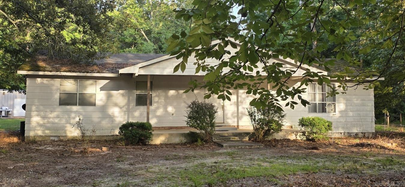 This 3-bedroom, 2-bath home offers privacy and plenty of room to enjoy the outdoors. The property sits on 4.34 acres and features a spacious 30x40 shop, perfect for hobbies, storage, equipment, or a workshop. Plumbing and water heater are new.  Whether you're looking for a place to spread out, start a hobby farm, or simply enjoy the tranquility of country life, this property has endless potential. Being sold AS-IS, giving buyers the opportunity to make it their own.  If you've been searching for a quiet retreat this could be the one you've been waiting for!