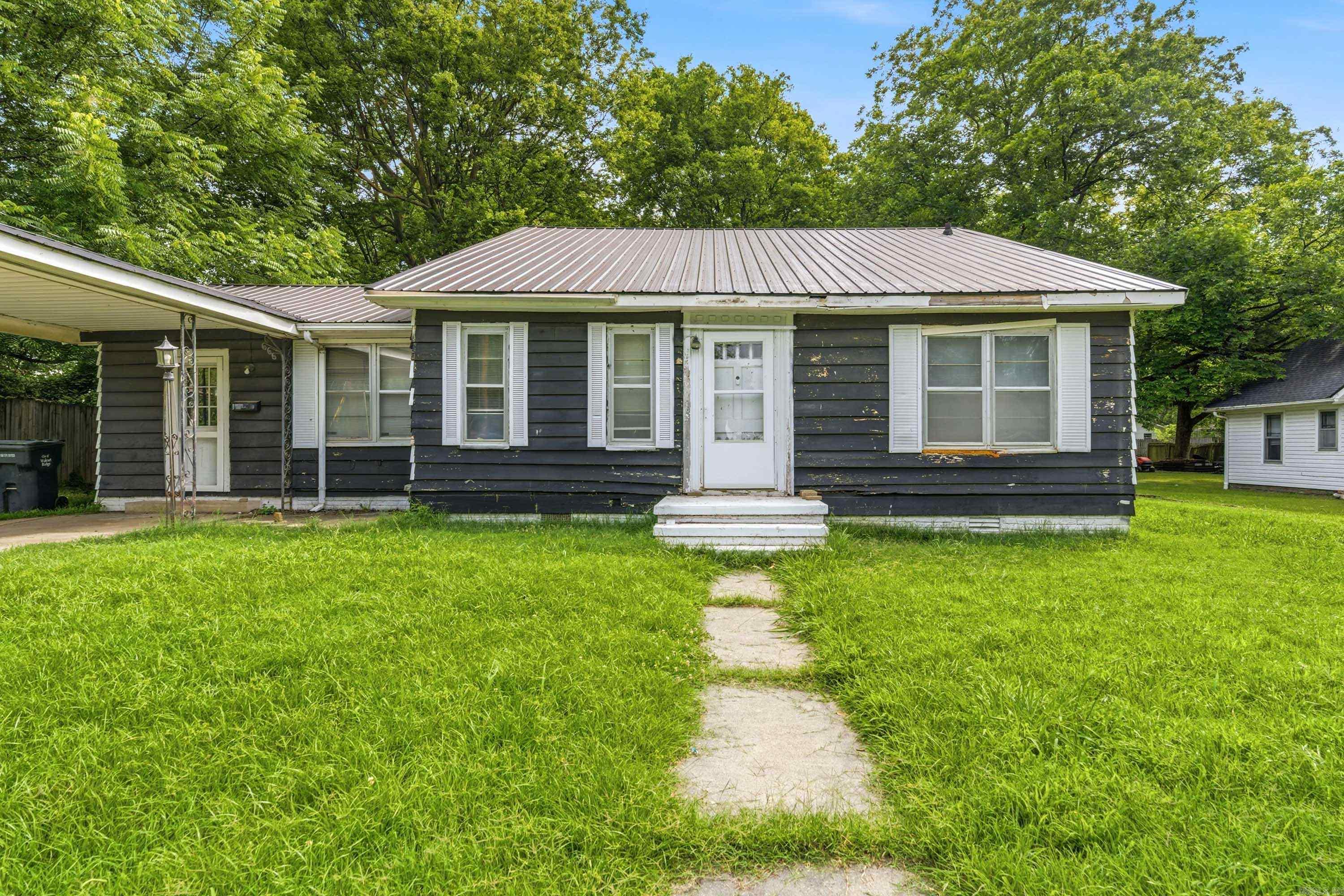 Welcome to 124 W. Poplar Street in Walnut Ridge, a spacious opportunity packed with potential! Offering 2,368 square feet, this 3 bedroom, 1.5 bath home provides plenty of room to create the home you've always envisioned. Inside, you'll find two living areas, a formal dining room, a dedicated laundry room, and a versatile bonus room that could serve as a home office, playroom, hobby space, or additional bedroom. This fixer-upper is ideal for investors, renovators, or buyers looking to build equity through updates and improvements. The generous floor plan offers endless possibilities for customization while preserving the home's existing character and charm. Outside, a detached workshop provides excellent space for projects, storage, or equipment. Whether you're searching for your next investment property or a home with tremendous upside, 124 W. Poplar Street is a rare opportunity to unlock value and make it your own. Don't miss your chance to bring your vision to life schedule your showing today!