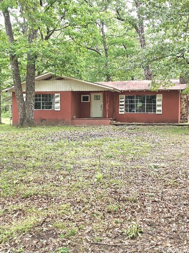 Charming 2-bedroom, 1-bath home situated on 8.25 beautiful acres offering a mix of open space and wooded privacy. This property features a peaceful setting with  fruit trees and plenty of room to enjoy nature or expand, and is located close to the Cossatot River State Park. The home includes a new refrigerator and stove, tankless water heater, along with a 2-year-old HVAC system for added comfort and efficiency. Washer, dryer, and freezer will convey with the sale, providing extra value and convenience. While the home could use some updates, it presents a great opportunity for buyers looking to add their personal touch or invest in acreage with potential. Ideal for those seeking a quiet rural lifestyle, hobby farm, or weekend retreat. located close to Cossatot River State Park. Don’t miss the chance to own this versatile property with plenty of possibilities!