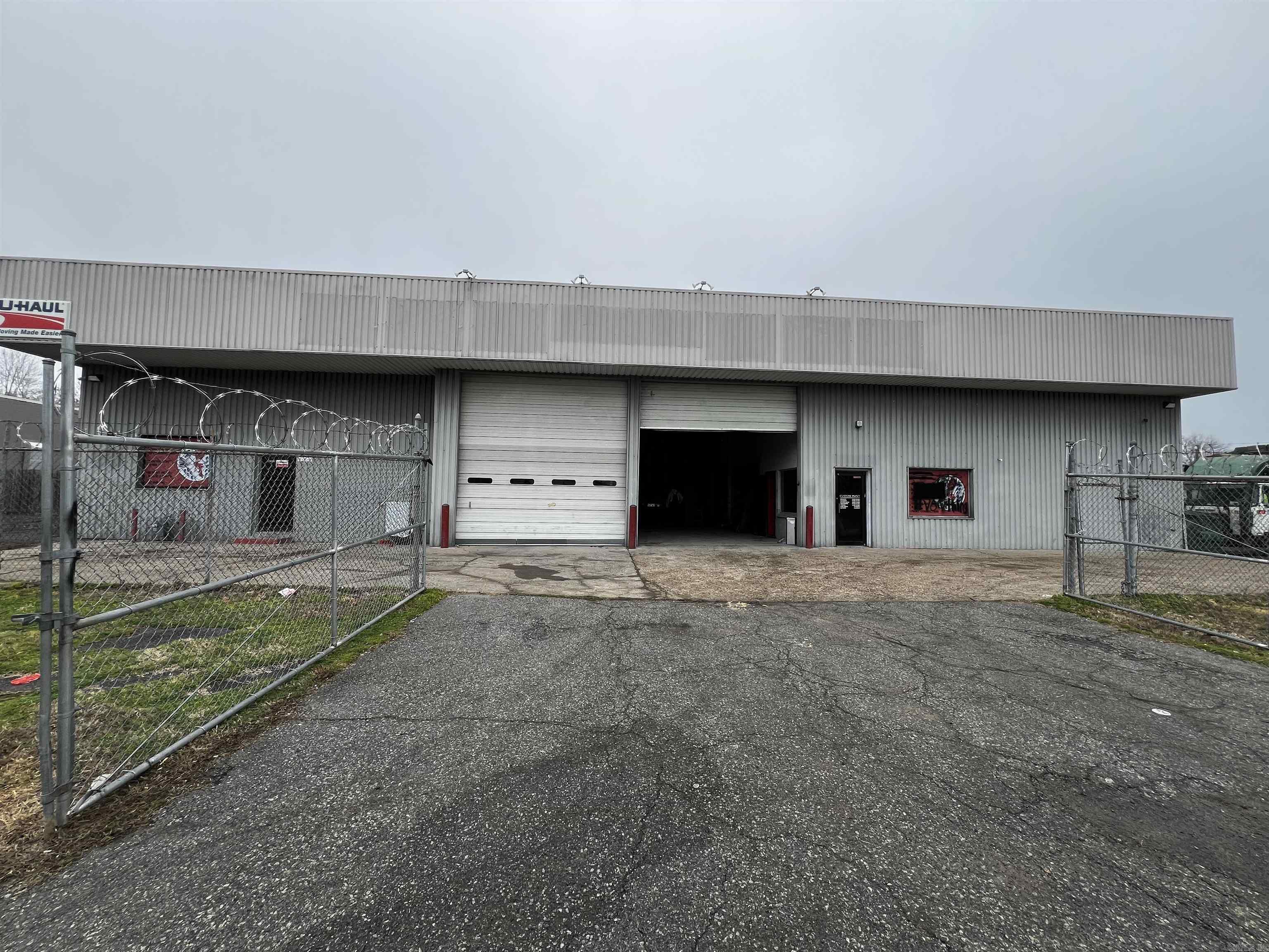 This shop has all you need to start up your business on day one.  It has multiple work bays with retractable overhead doors.  The building conveys with a car lift, framing machine, two paint rooms, tools, chrome machine.  Building has two offices and three bathrooms.  Lots of parking inside the building along with several parking spaces inside the fenced in land area.  This could be a great money maker for the right buyer or an investor that would like to rent the space out for monthly income flow.  Bring an offer and let's make a deal.