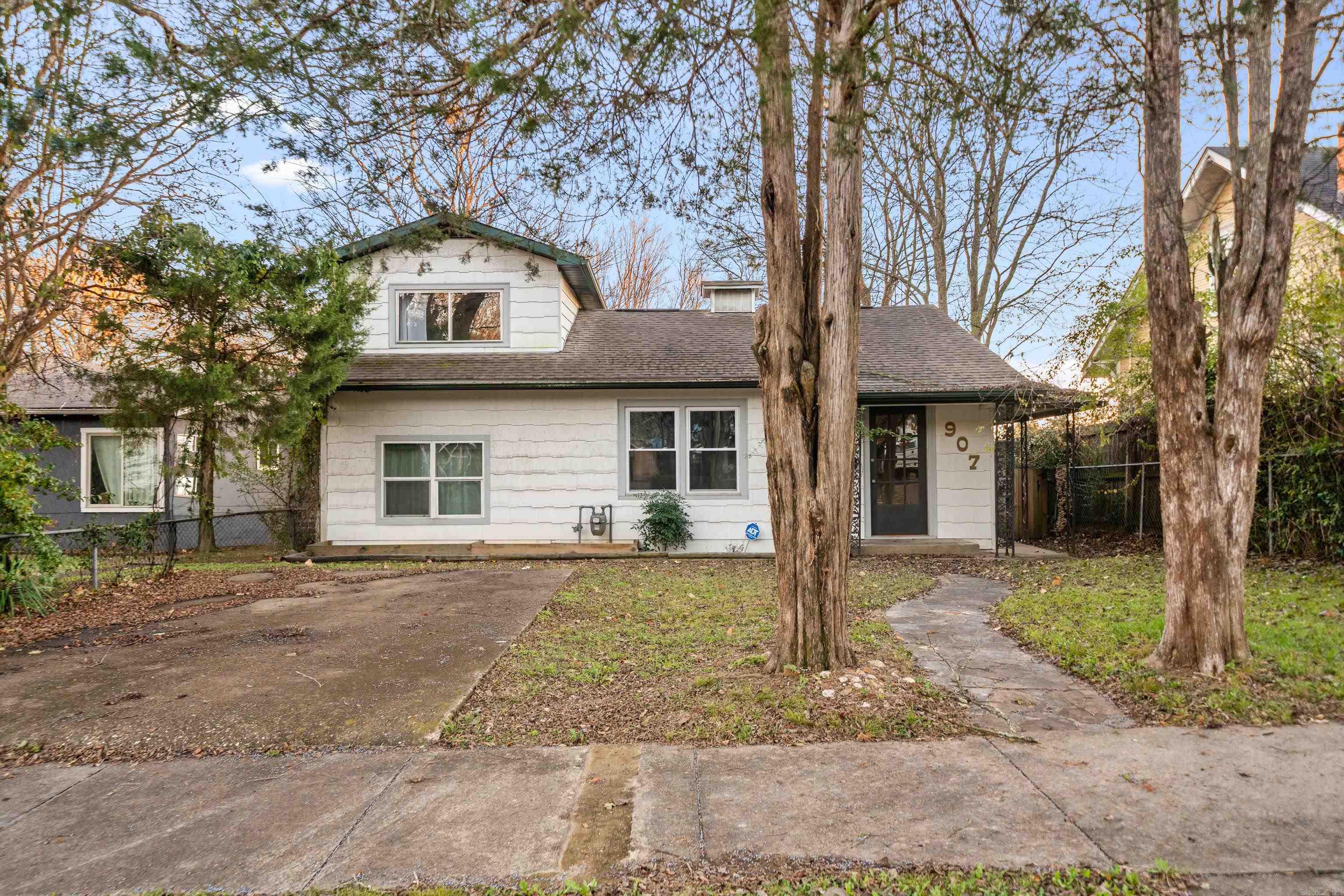 Charming, newly remodeled home offering move-in-ready convenience and timeless appeal. This property showcases original craftsmanship throughout, adding character you don’t find in newer construction. Beautifully refinished wood floors, fresh updates, and a custom built-in wine bar create a warm and inviting atmosphere. The fully fenced yard is ideal for pets, play, or outdoor entertaining. Located in a quiet neighborhood, yet just minutes from downtown, parks and shopping, this home offers the perfect blend of charm, functionality, and accessibility.