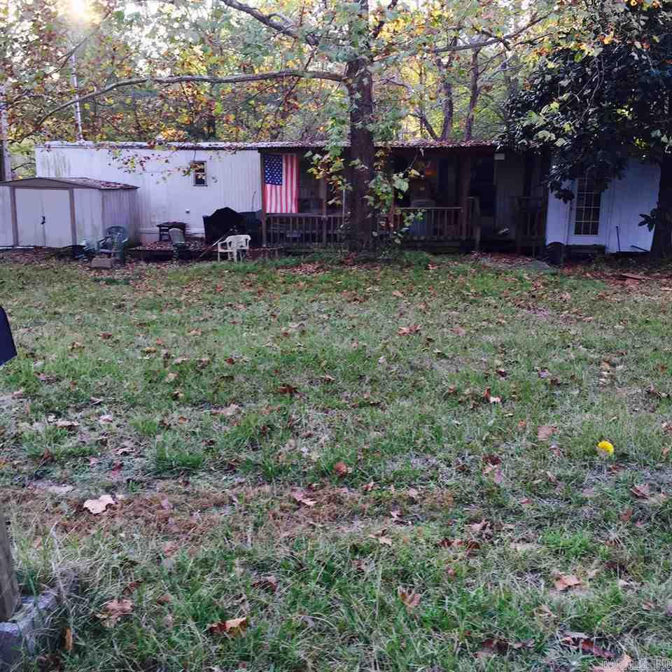 This neighborhood is quite and peaceful!  Mobile home is in need of much repair, but could be livable with some TLC.   Mobile home could be moved and another moved in or you could build home here also.  Several homes have been constructed in the neighborhood.