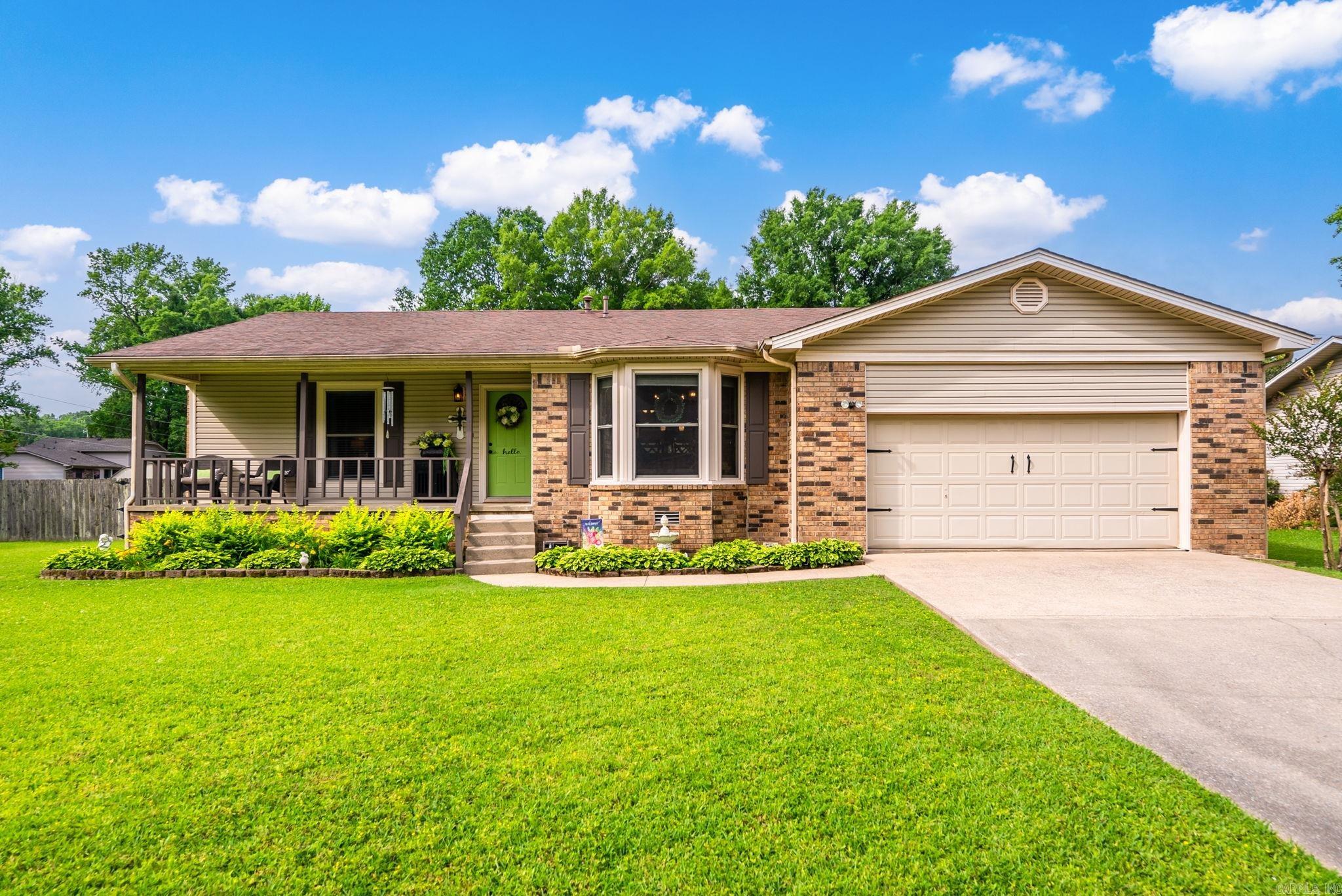 This little charmer checks all the boxes! Situated on a beautifully landscaped corner lot in a secluded subdivision, this well-maintained home offers incredible space both inside and out. Enjoy summer days by the sparkling pool, entertain on the huge New deck, or relax in the bright sunroom overlooking the private fenced backyard. Inside you’ll love the oversized living room with vaulted ceilings, warm wood beams, and a cozy fireplace. The split floor plan provides privacy, while the spacious primary suite and generously sized rooms make everyday living comfortable. Additional features include new deck, updated ceiling fans and interior hardware, gutters w/covers, a 2-car garagew/storage, additional outside storage building, great curb appeal, and easy interstate access for a quick commute. A perfect blend of comfort, charm, and outdoor living! Flood insurance is $67 p/m
