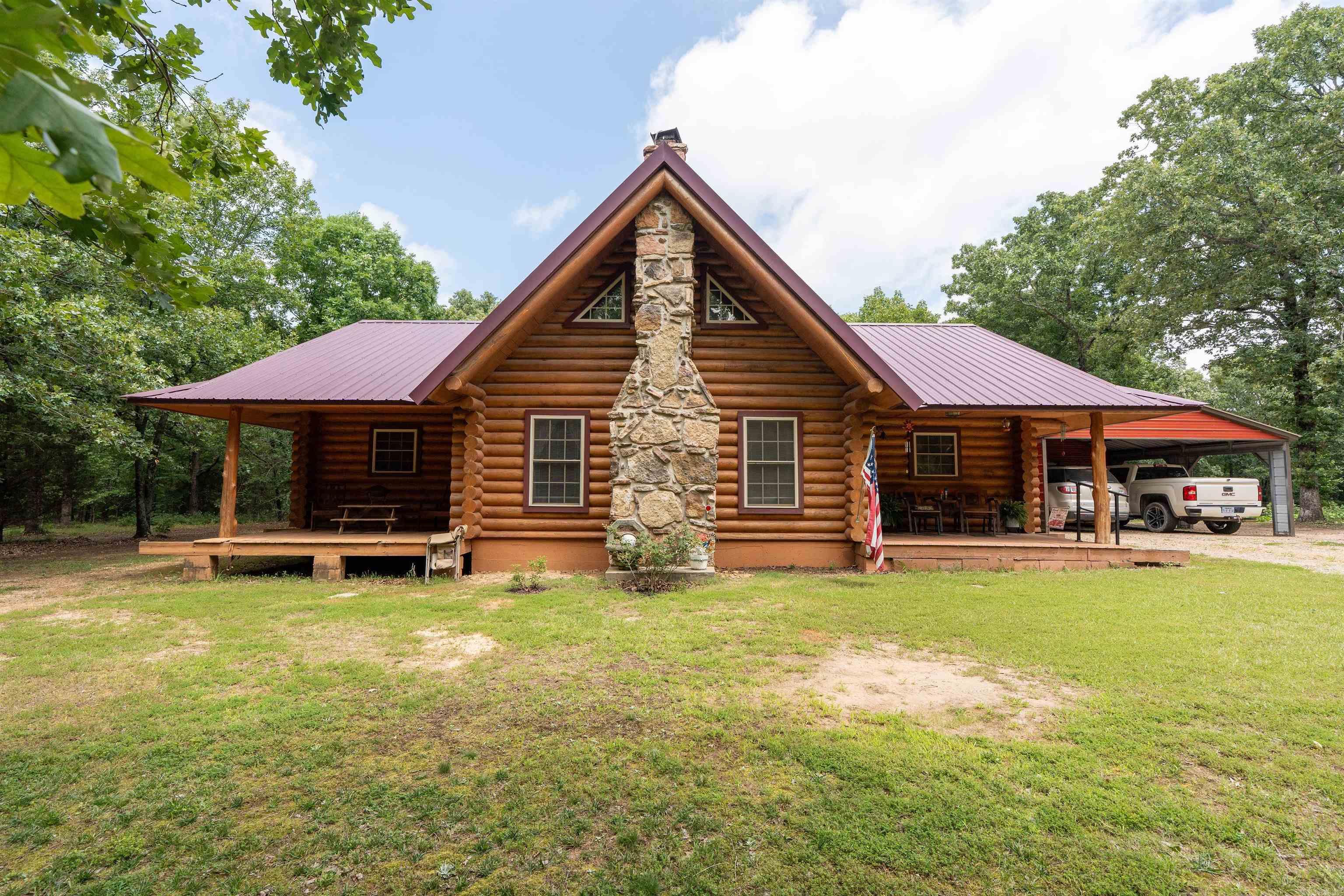 Escape to the beauty of the countryside with this gorgeous log cabin nestled on 22.4 acres.  This charming 2 bed/2 bath home features warm wood ceilings, a cozy fireplace and a spacious loft complete with private balcony overlooking the property.  The well-designed floor plan includes a dedicated laundry room and walk-in closets.  Outside you will find abundant wildlife, making this property a nature lover's dream.  There is plenty of room for gardening, or simply enjoy life in the country. Whether you are looking for a full-time residence or weekend retreat, this beautiful log cabin is a rare opportunity to own your own slice of country living at it's finest.  Agents see remarks before showing