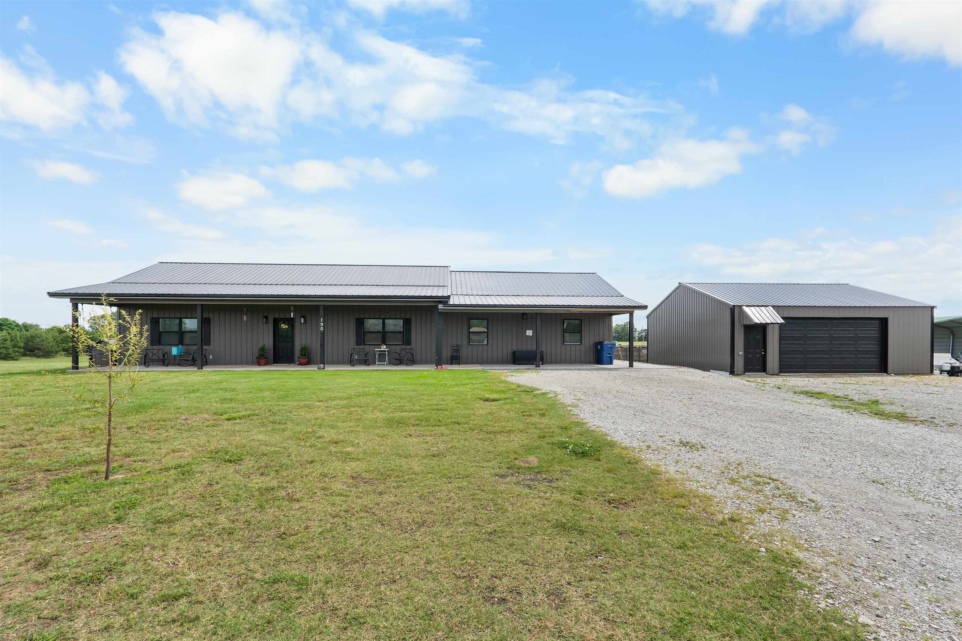 Barndominium-style home on 5 beautiful acres! This 4 bedroom, 2 bath home features a large living area/den located off of the kitchen/dining room. The kitchen has granite countertops, stainless appliances, island, and a walk in pantry. The master bedroom offers a large walk-in closet & an attached bathroom with a walk in shower. The guest bedrooms are very spacious.  In addition there is a 30x30 shop that is insulated, has electric and RV hookup, a large front porch, covered back patio, wraparound concrete walkway, above-ground pool, and storage building. Country living with all the extras! Located near Lake Norfork & the White River!