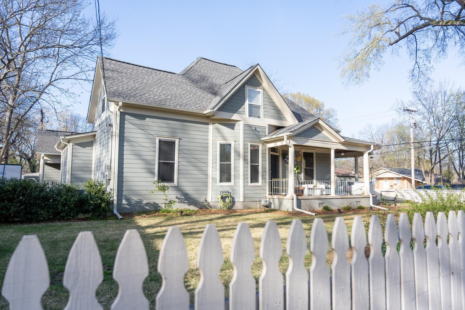 Charming Craftsman-style home full of character, situated on a corner lot with the convenience of downtown Conway nearby. Enjoy relaxing on the inviting wraparound porch and the curb appeal of the classic picket fence. This well-maintained home has seen numerous updates and is move-in ready. The layout offers two bedrooms on the main level and a total of three bathrooms, along with abundant storage throughout. Additional features include a carport with attached storage space, and sprinkle system.  A wonderful opportunity to own a character-filled home in a desirable and convenient location. Agents measurements are under documents.