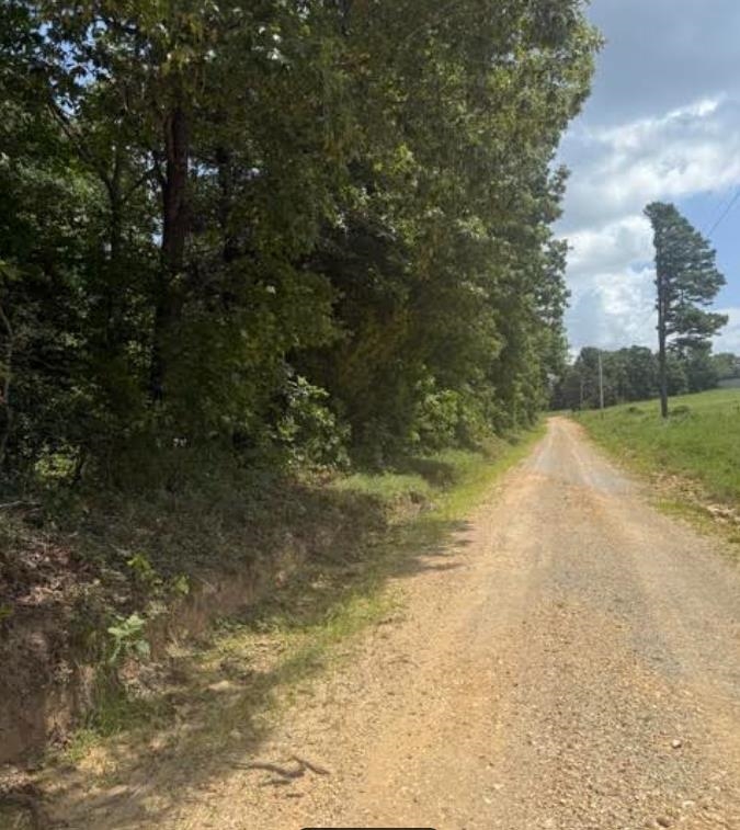 5.05 Wooded Acres-Ready for Your New Home or Hunting Retreat  Escape to your own slice of the Ozarks. This 5.05-acre wooded tract offers a serene, wooded environment with excellent topography, perfect for a private homestead, weekend getaway, or hunting retreat. The property features a desirable blend of gentle slopes and great building sites surrounded by native hardwoods and pines.  Outdoor enthusiasts will love the location—close to the world-class fishing of the White River and within 15 minutes of boating and swimming at Lake Norfork. Enjoy the quiet of the country while staying just a short drive from the services and shops in Viola and Mountain Home.