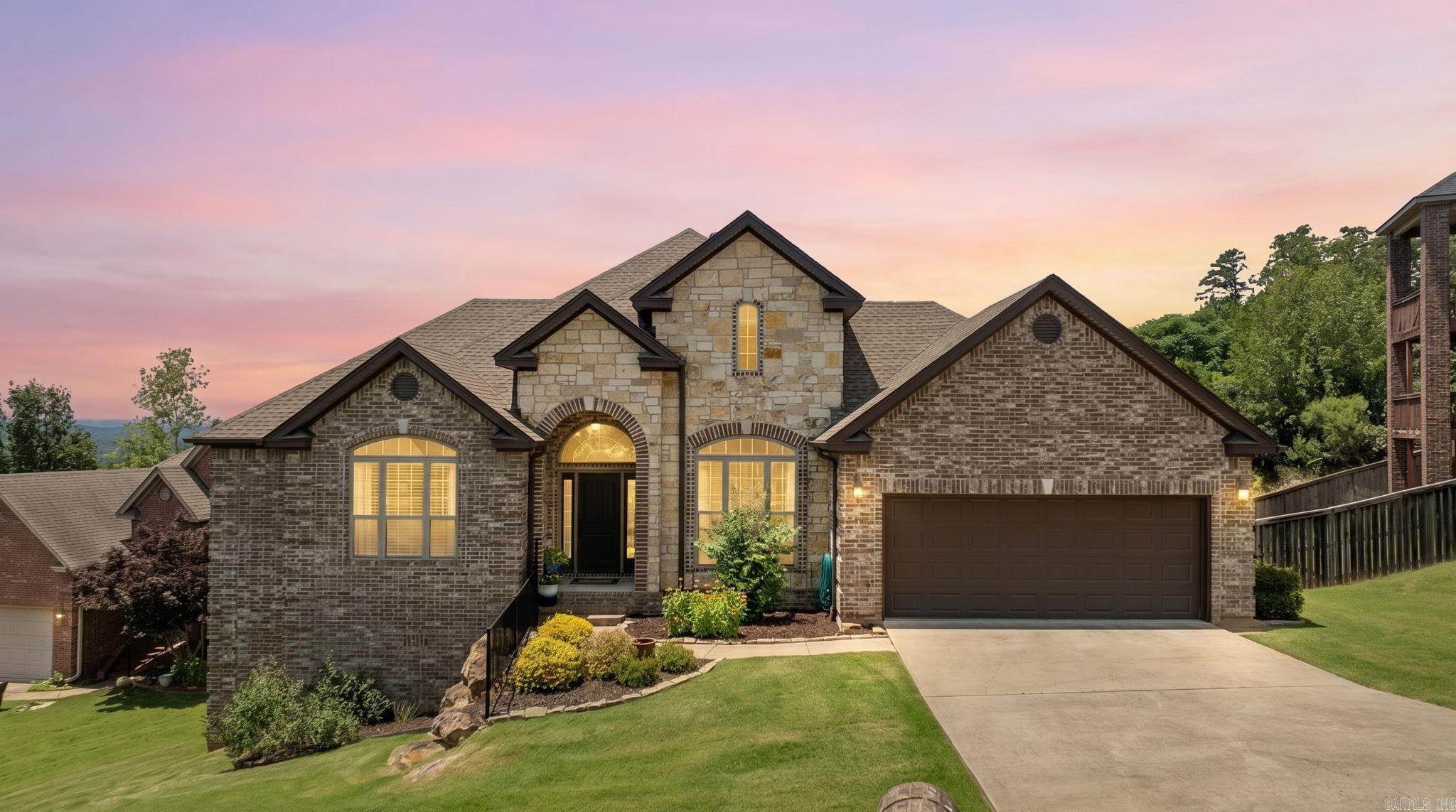 Welcome to 124 Crestview Drive in Maumelle's sought-after Majestic Point subdivision! Tucked away on a quiet cul-de-sac, this stunning home offers breathtaking views of Pinnacle Mountain and some of the most beautiful sunsets in Central Arkansas. Inside, you'll find soaring ceilings, abundant natural light, an open floor plan, and a double-sided fireplace that creates a warm, inviting atmosphere. The spacious primary suite features private balcony access and two walk-in closets, providing the perfect retreat at the end of the day. One of this home's most unique features is the rare flat backyard—a true gem in a neighborhood known for its rolling terrain. It also has EV charging in the 2 car garage! Whether you're entertaining, playing with pets, or simply enjoying the view, this outdoor space offers endless possibilities. Conveniently located just minutes from grocery stores, restaurants, parks, walking trails, and the community pool, this home offers the perfect blend of scenery and convenience. Best of all, this exceptional property has been competitively priced to sell, creating an incredible opportunity to own one of Maumelle's most remarkable view homes. Don't miss it!