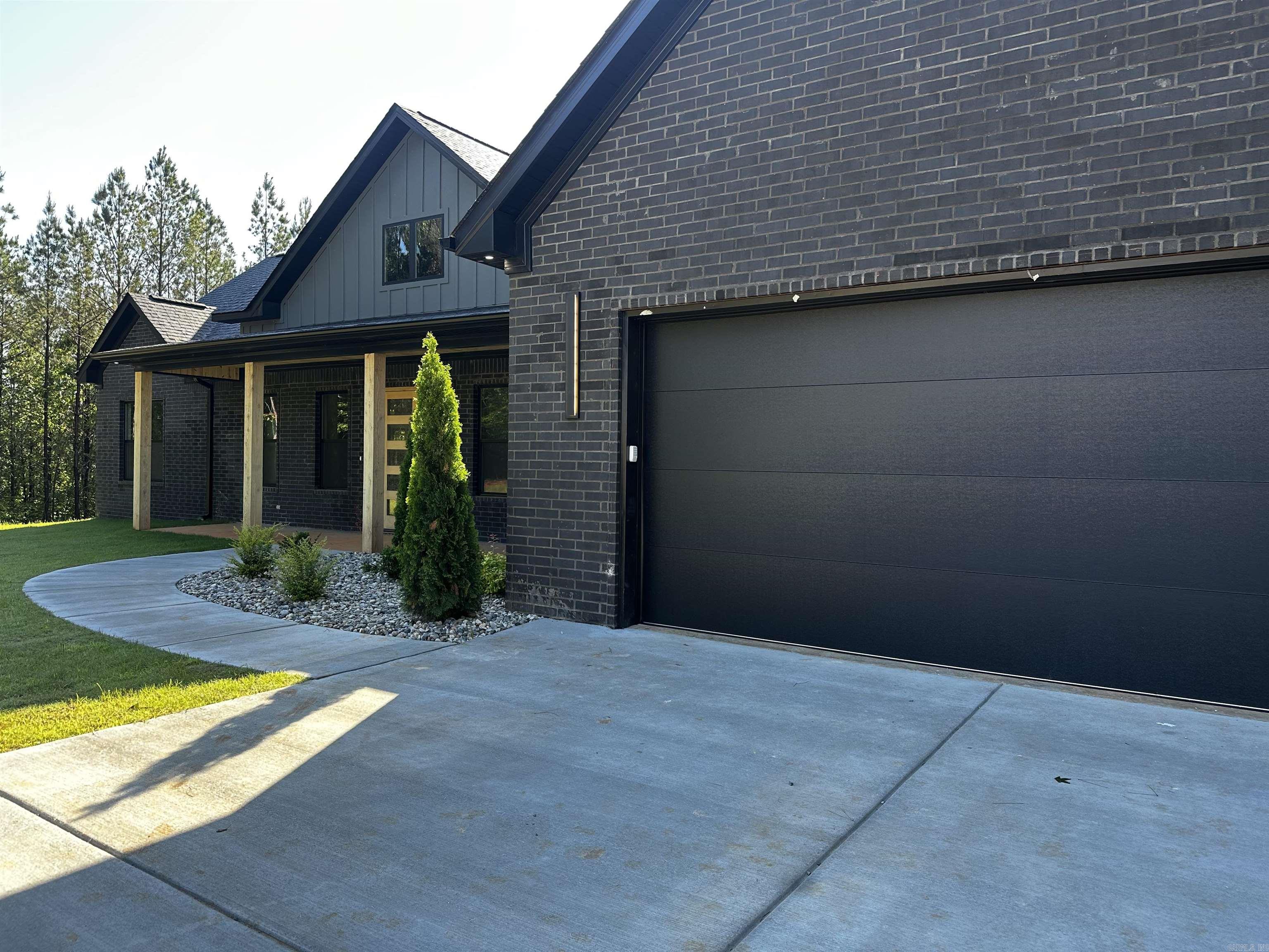 This unique property offers the perfect blend of privacy and convenience, all just minutes from town. Featuring 3 bedrooms, 2.5 bathrooms, an office, and a bonus room, this home was thoughtfully designed for both functionality and comfort. A spacious mud area creates the perfect place to drop the day behind as you step inside.  The primary suite features a large walk-in shower, while hardwood-look tile flows throughout the home for a seamless and modern feel. Stylish light fixtures, a sleek LED fireplace, and a beautifully designed kitchen add to the home’s elevated character and charm.  Surrounded by 10 peaceful acres, this property offers the serenity and space you’ve been searching for. This is one you won’t want to miss.