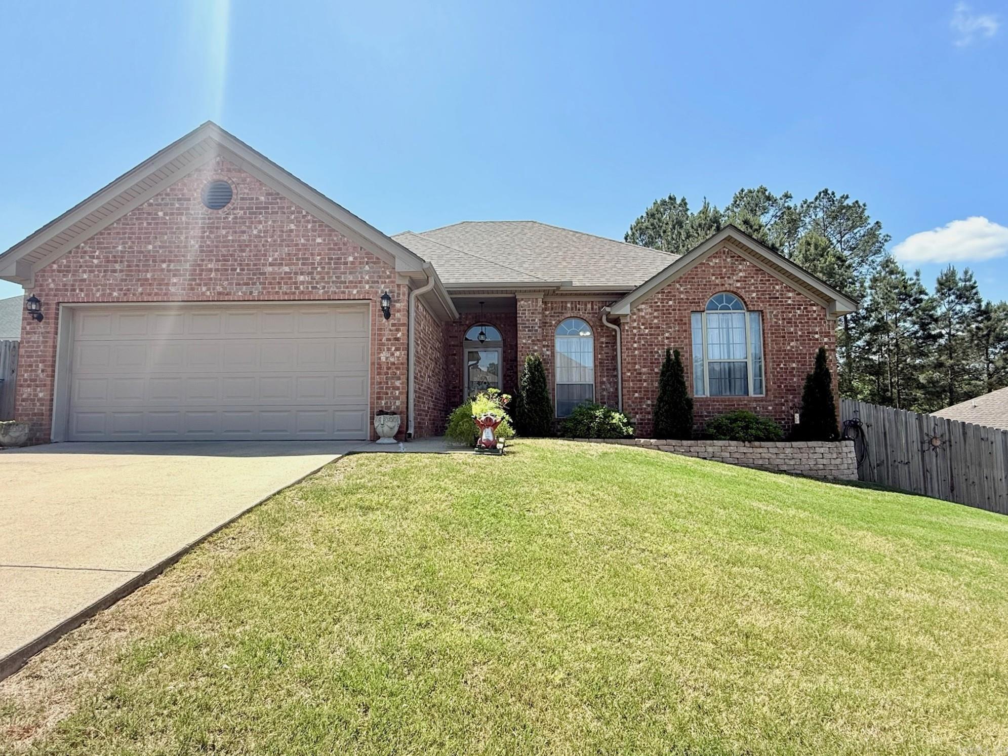 Stop Scrolling!  *RD ELIGIBLE* If youre looking for a great home and a large yard, this is it.  Walk into oversized entryway and Living room with 10 ft ceilings, woodburning fireplace, open to the kitchen.  Split floor plan with LVP in main living areas and primary bedroom.  Double closets in primary suite, jetted tub and walk in shower. Kitchen  features stainless appliances, breakfast bar, and eat in kitchen. Walk out to the covered patio, and enjoy a peaceful backyard, fully fenced with large storage building and trees to make it more peaceful and private.  Agents see remarks for updates.