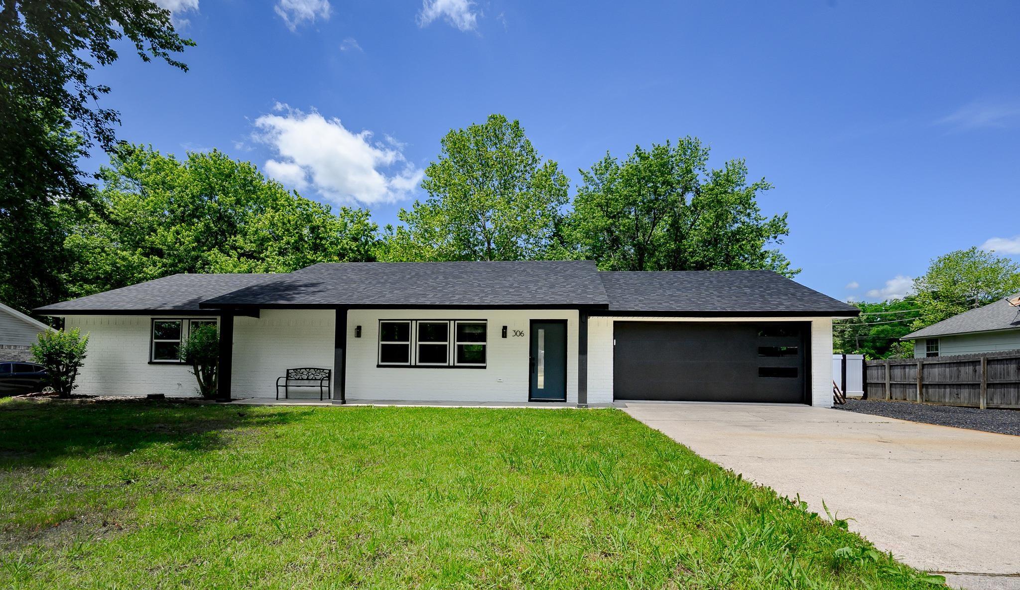 Absolutely STUNNING, TURN-KEY, 4bed/3bath home on a quiet cul-de-sac. This Complete Remodel  was expertly and thoughtfully completed, featuring countless attractive modern design features! The home includes NEW windows and doors throughout, luxury vinyl flooring, new fixtures, attractive paint inside and out, and ALL NEW APPLIANCES. The beautiful kitchen features gorgeous quartz countertops, new attractive cabinets, and nice touches such as under cabinetry lighting, and built in electrical outlets in the island! Recessed lighting has been tastefully added throughout the build. The open concept living area features large windows and tons of space for relaxing or entertaining. There is a spacious, private master suite as well as 3 additional large bedrooms! The bathrooms feature lighted bathroom mirrors, brand new sinks, toilets and showers/bathtubs, and lovely lighting fixtures. The electrical and plumbing have also been completely updated. There is a brand new HVAC, tankless water heater, vinyl fencing, and ROOF! The home has a 2-car garage that has also been redone. If  you’re looking for a picture perfect home just minutes to town, this is it!