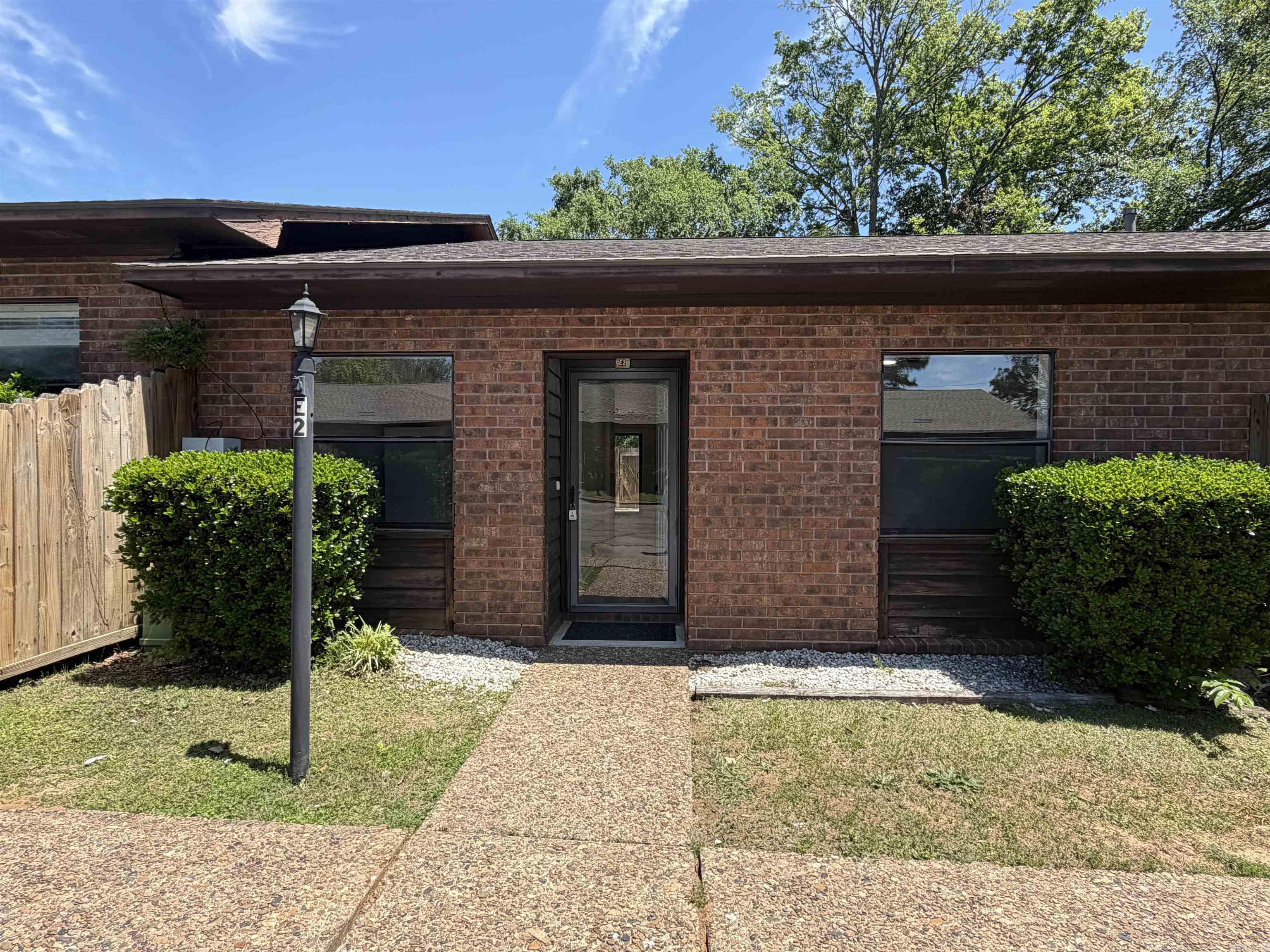 UPDATED 2bed 2bath walk in 1 level all brick condo in super convenient location. NEW paint, LVP flooring, LED lights & fans, SS kitchen appliances. Entire complex has a new roof. Quiet area but easy access to Airport Rd & the bypass. Unit comes with stack washer/dryer and fridge.  Private fenced in outside patio. Super easy living. Big covered pavilion with picnic tables for common use. Swimming pool. HOA fee covers exterior maintenance and grounds so life is easy! Good rental potential. THIS LISTING FOR UNIT E2. YOU CAN ALSO BUY UNIT E3 AND HAVE 2 UNITS SIDE BY SIDE. See agent remarks.