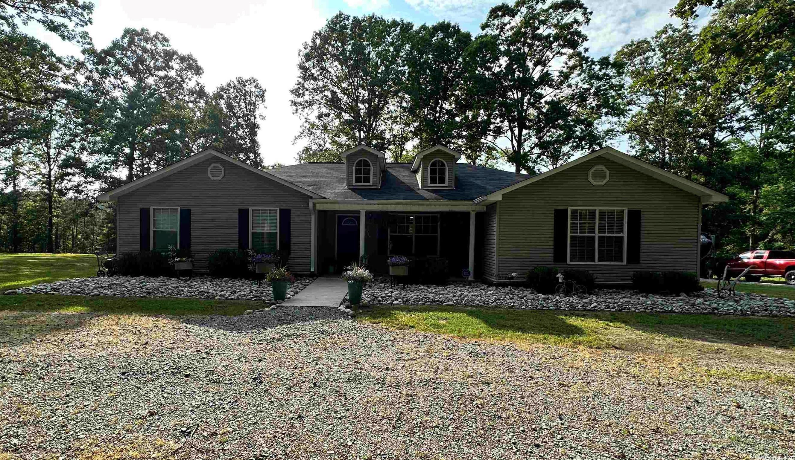 Located off of Neighborhood Drive close to Highway 167 this gorgeous recently updated 3 bedroom, 2 bathroom home is located in East End area! Offering pristine elegance and charm, this three-bedroom, two-bathroom home boasts beautiful flooring throughout. From the moment you step inside, you'll be wowed by the impressive attention to detail and quality materials utilized to create a stunning living experience.  Split floor plan boosts bedrooms on one end with the living, kitchen and dining. Be ready to prepare all of your dinners in this gourmet kitchen and serve meals in your formal dining area or pull up a seat to the island while you brew your coffee at the beautiful dry bar with built in cabinets.  But it doesn't stop there. This home also features security lights outside, allowing you to feel safe and secure at all times. Meticulous landscaping plus, there are RV hookups and a large shop with a gated lean-to for equipment storage, providing additional value and convenience to this already impressive property.   If you are searching for country living, look no further!