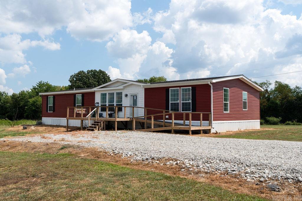 135± acres just outside Quitman city limits, offering endless possibilities for recreation, farming, or investment. This beautiful property includes a brand new 4-bedroom, 3-bath manufactured home with an open floor plan, two ponds, a barn, and partial fencing. Two producing gas wells and mineral rights convey with the sale. Enjoy wide open spaces with a mix of cleared and wooded land, perfect for livestock, outdoor activities, or future development. Located right next to the Quitman ballpark, this property offers a rare combination of privacy, convenience, and room to grow. With stunning views, modern living, and plenty of acreage, it’s ready for your next chapter.  Seller is willing to separate the property.