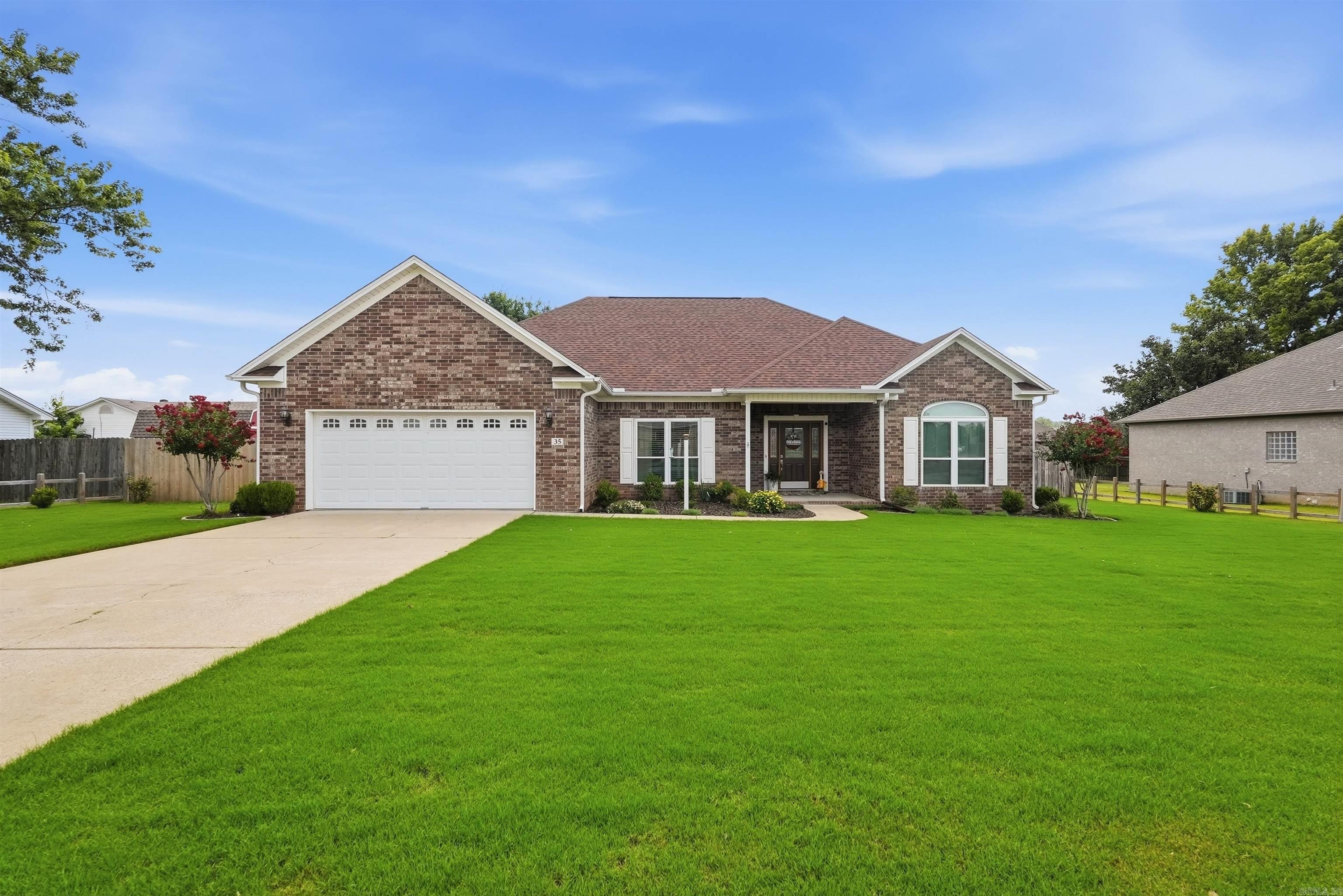 Welcome to 35 Applewood Cove in Cabot! This beautifully maintained 3-bedroom, 2-bath home offers the perfect blend of comfort, functionality, and charm. This home features an array of wonderful upgrades including new windows (2026), newer roof and gutters (2023), newer flooring, and so much more! From the moment you arrive, you'll appreciate the mature landscaping, inviting curb appeal, and evident pride of ownership throughout. Inside, you'll find a warm and welcoming layout with thoughtful updates that make the home feel fresh and move-in ready. A dedicated office provides the perfect space for working from home, managing household projects, or creating a playroom conveniently located near the main living area. Step outside and enjoy a backyard designed for everyday living, featuring a covered patio, garden space, mature landscaping, and additional storage. Whether you're entertaining guests or enjoying a quiet evening at home, this property offers spaces you'll love both inside and out. If you've been searching for a home that's been exceptionally cared for and thoughtfully updated, 35 Applewood Cove is one you won't want to miss.