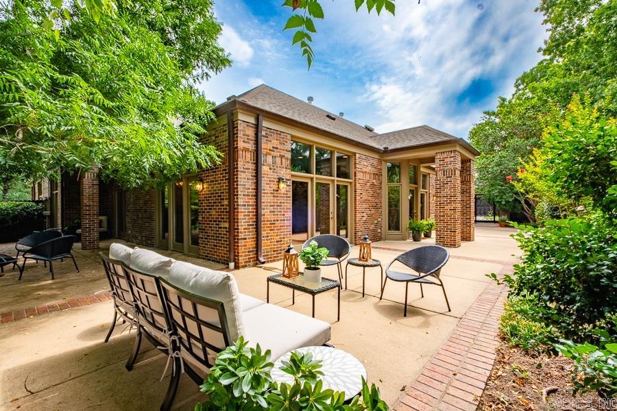 Exceptional residence located in the highly desirable gated Riverbend community, offering unparalleled privacy, security, and riverfront living. Completely updated in 2025, the home showcases soaring ceilings, walls of floor-to-ceiling windows, and beautiful new site-finished hardwoods throughout. The light-filled floor plan features multiple living spaces, formal dining, and a stunning chef’s kitchen with granite countertops and all-new appliances. Four spacious ensuite bedrooms include two luxurious main-level suites and two private guest retreats upstairs. Expansive patios and beautifully landscaped grounds create a serene outdoor oasis, while a private walkway and pier provide direct river access with breathtaking views of the bluffs and downtown skyline. Additional highlights include a two-car garage, abundant storage, a walk-in storage room, and floored attic space—offering the perfect blend of elegance, comfort, and convenience.