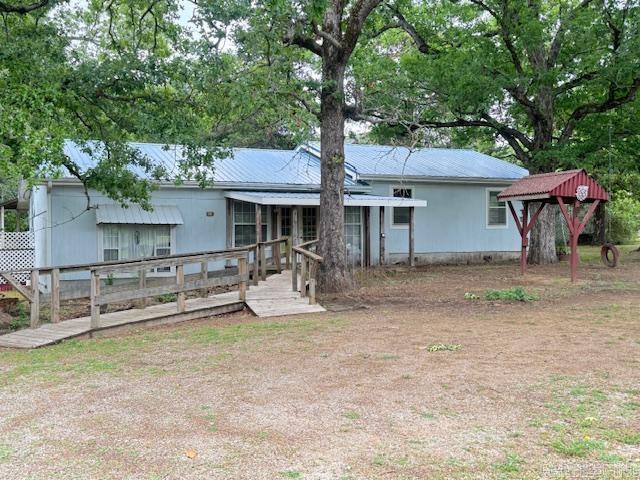 The setting and location will sell this property! 6.45 acres with character & so much potential. 3BR/1.50BA house, double carport with a shop as well! The home offers a spacious layout with multiple living areas & easily a 4 Bedroom. It has 1695 SF plus additional 435 SF which includes front enclosed sun filled porch giving greenhouse vibes right at your front door as well as a sunroom at the back off the dining area as an extended dining or sitting combo and a large laundry room. While this home does need some updating & tlc, it presents great opportunity to make it your own & add value over time. The shop is conveniently placed so if you have a business, the customers could have their own separate entry off Edgar Road. It has a concrete floor, overhead door & sliding door. Property is sold as is.